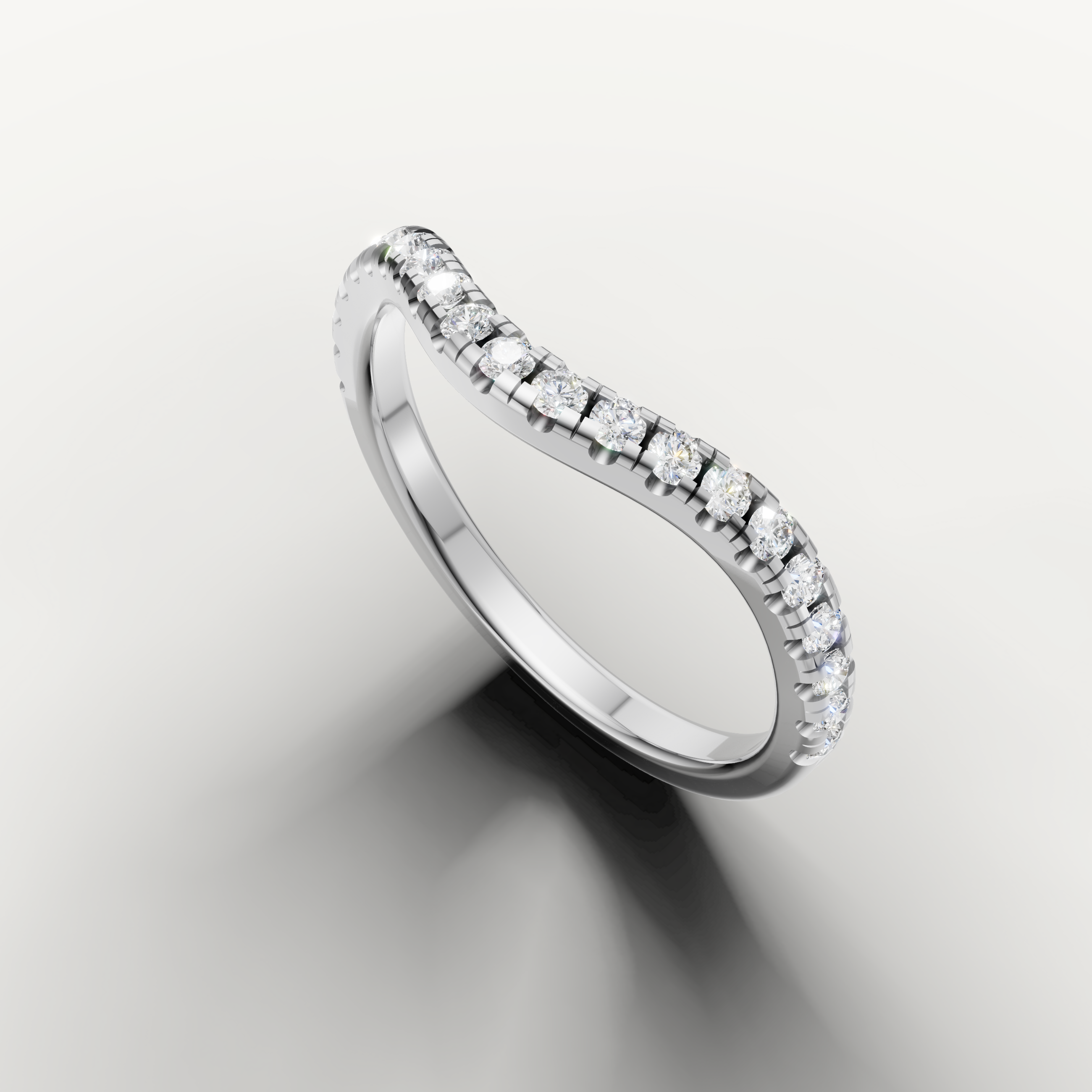 Elegant white gold curved eternity wedding band featuring brilliant diamonds by Raul Diamonds