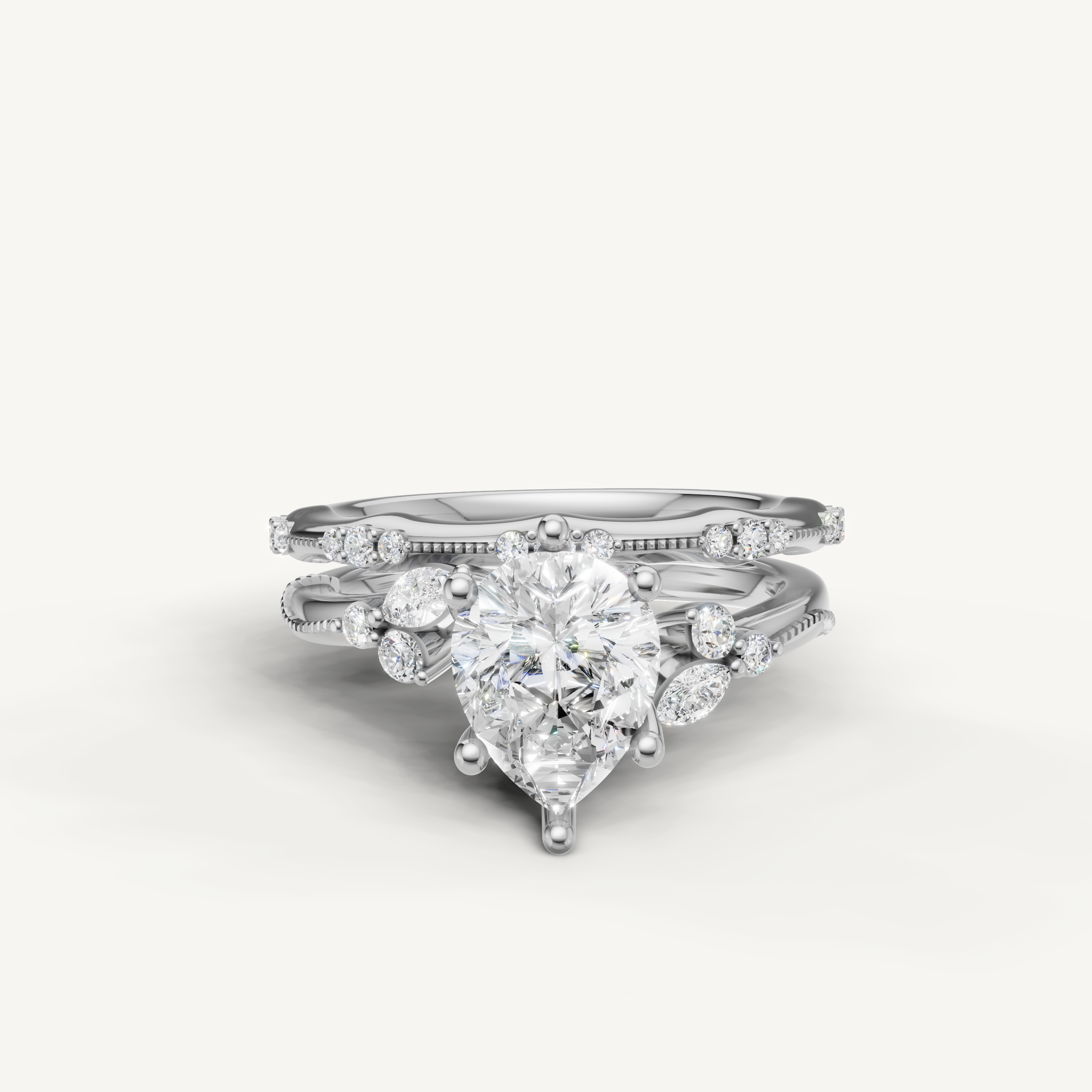 Raul Diamonds white gold pear cut diamond bridal set with matching diamond bands