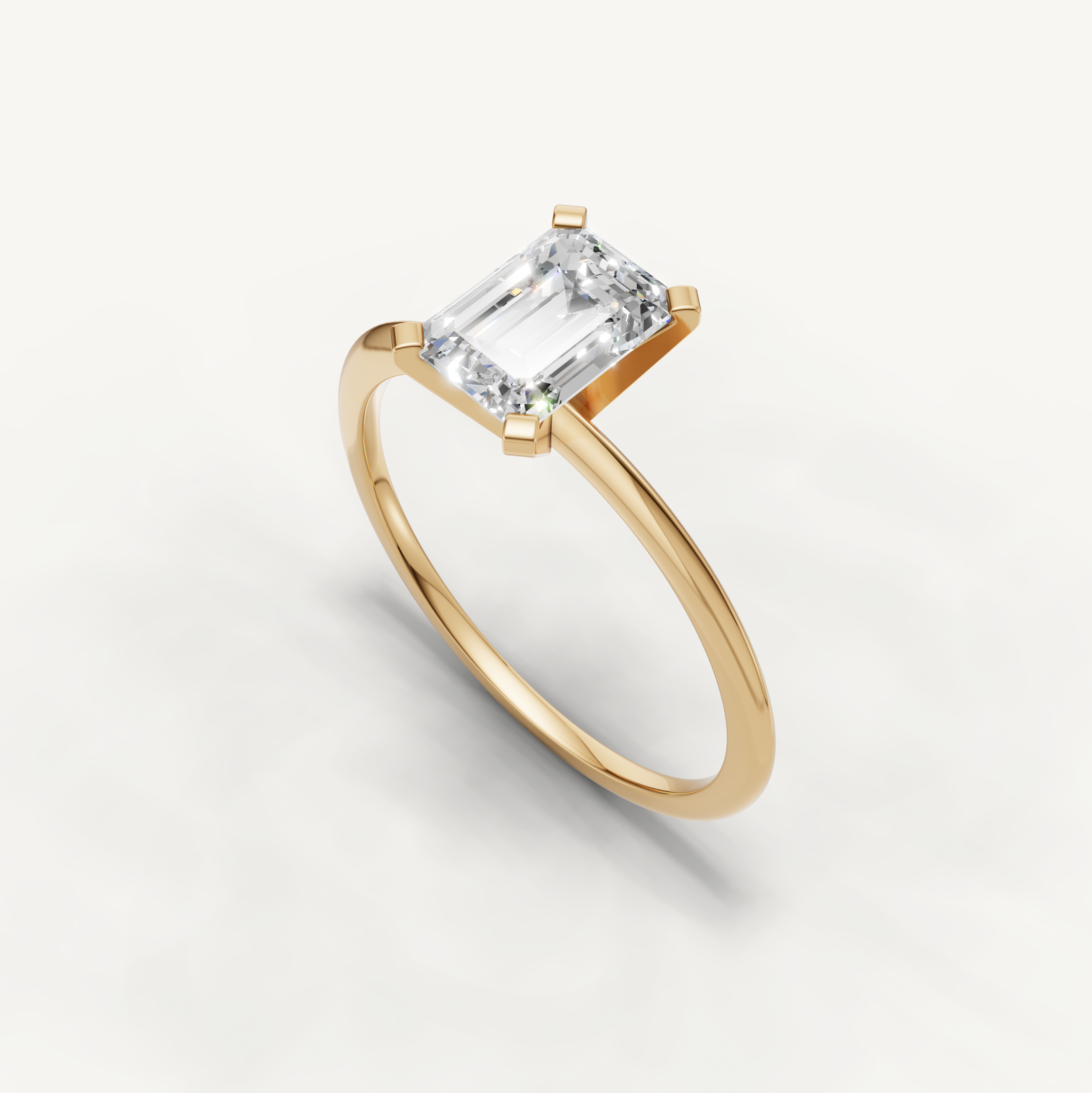 Minimal yellow gold emerald cut engagement ring with lab grown diamond by Raul Diamonds