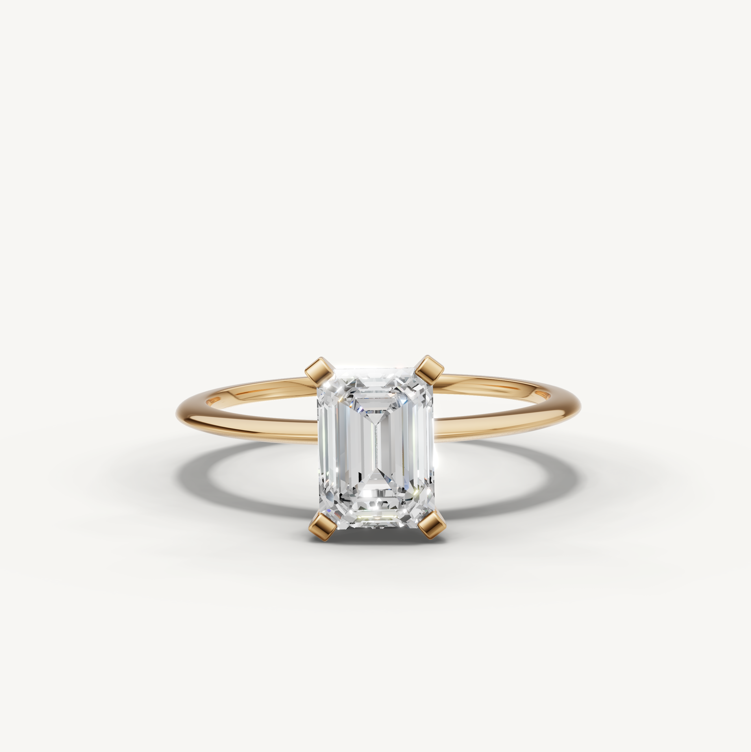 Emerald cut lab grown diamond solitaire engagement ring in yellow gold by Raul Diamonds