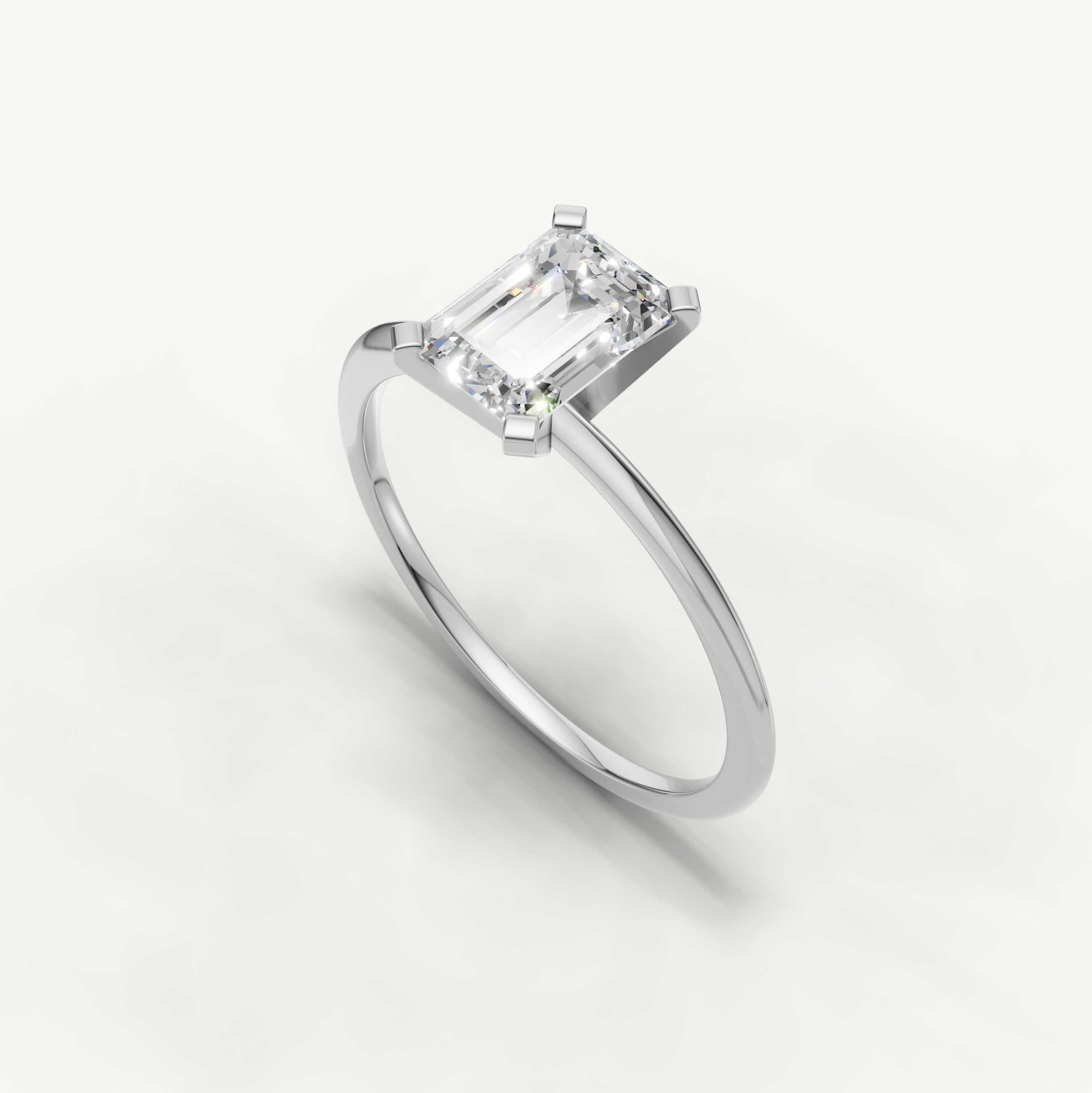 Minimal white gold emerald cut solitaire ring with lab grown diamond by Raul Diamonds