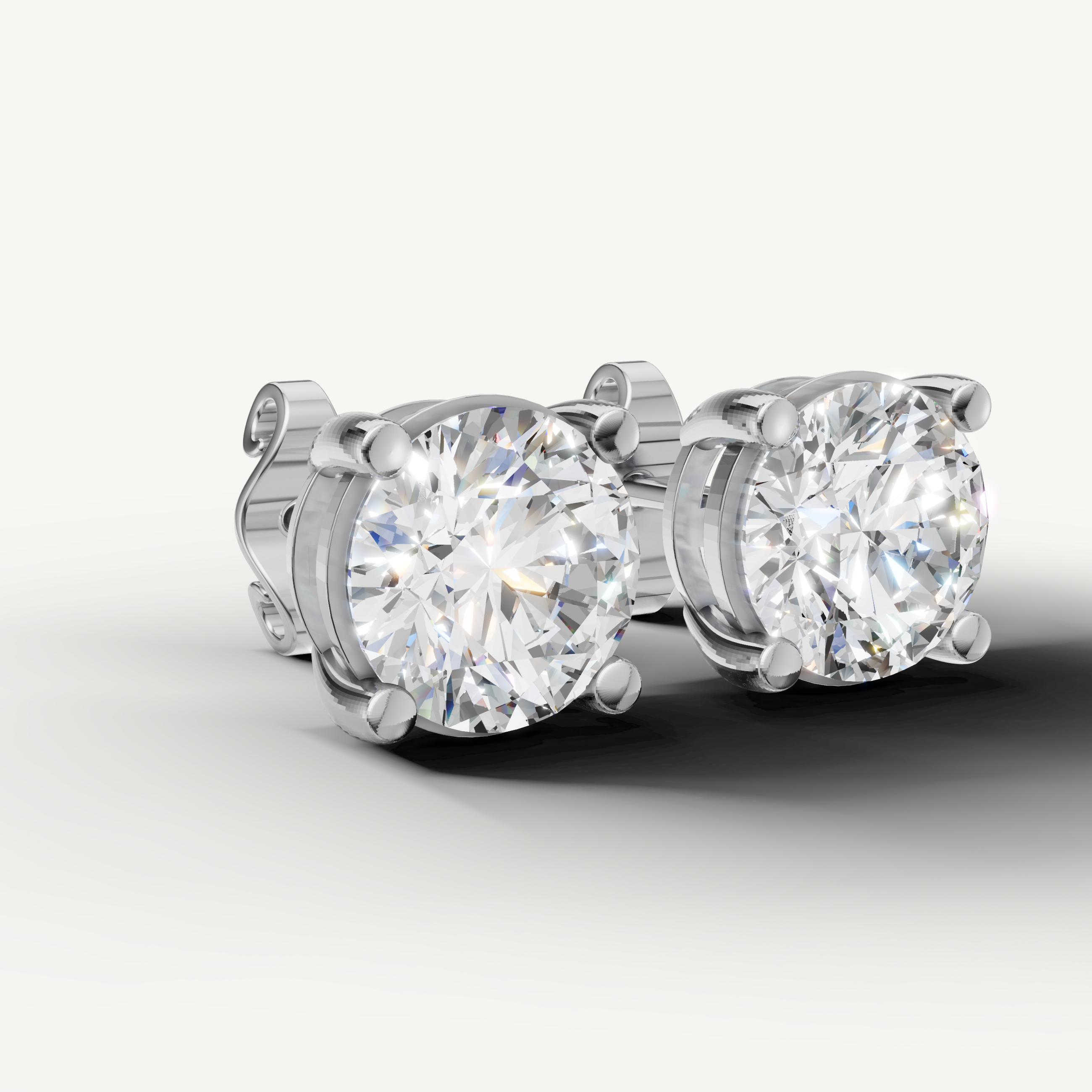 Luxury white gold solitaire diamond earrings for women with brilliant round cut diamonds by Raul Diamonds