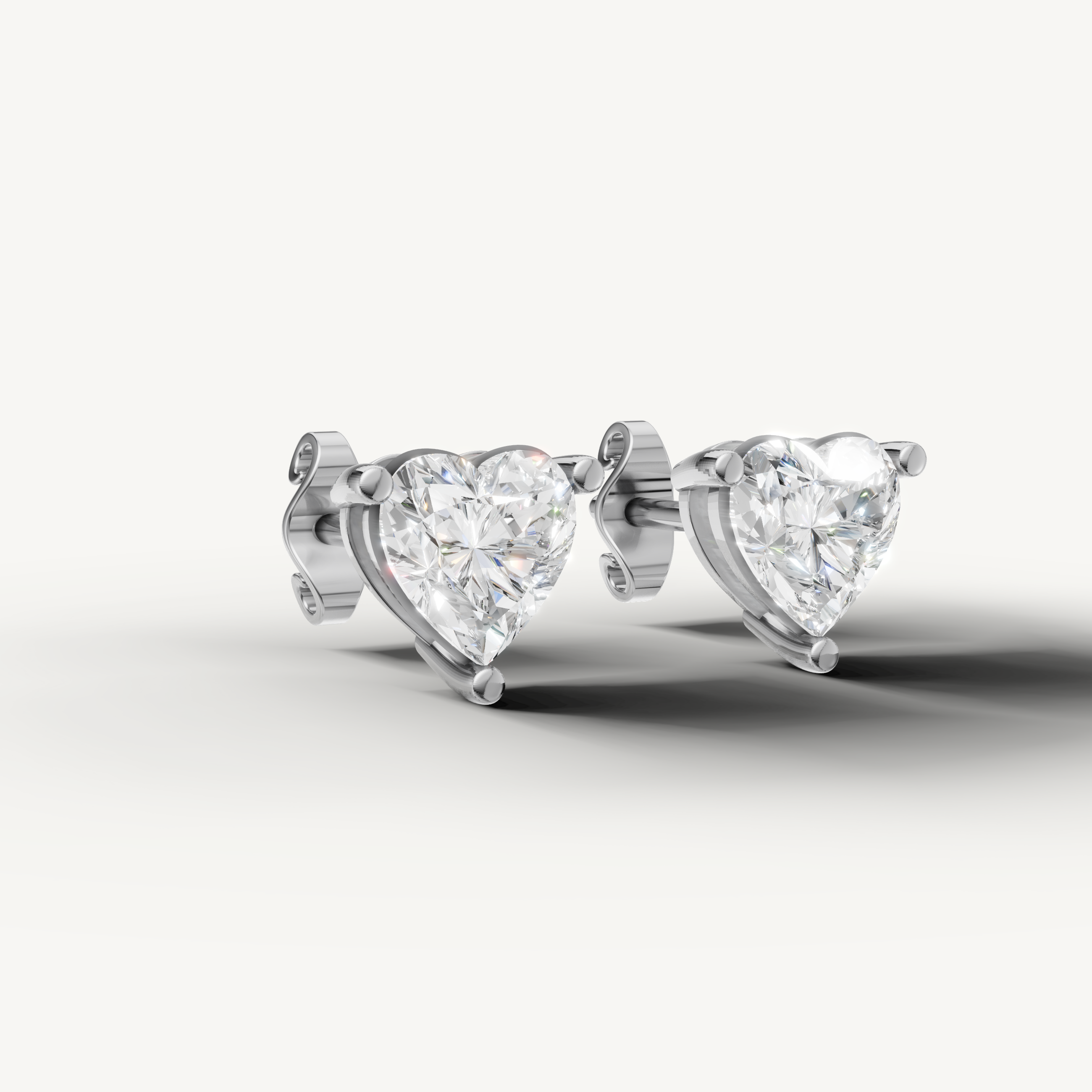 Luxury white gold heart cut diamond stud earrings for women with elegant brilliance by Raul Diamonds