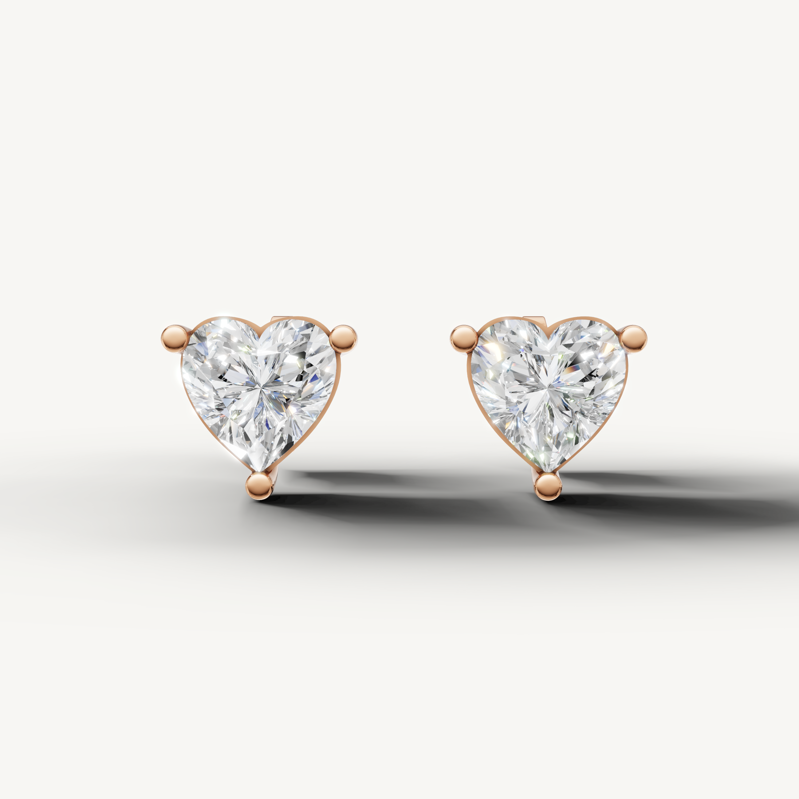 Raul Diamonds rose gold heart diamond stud earrings with sparkling solitaire brilliance