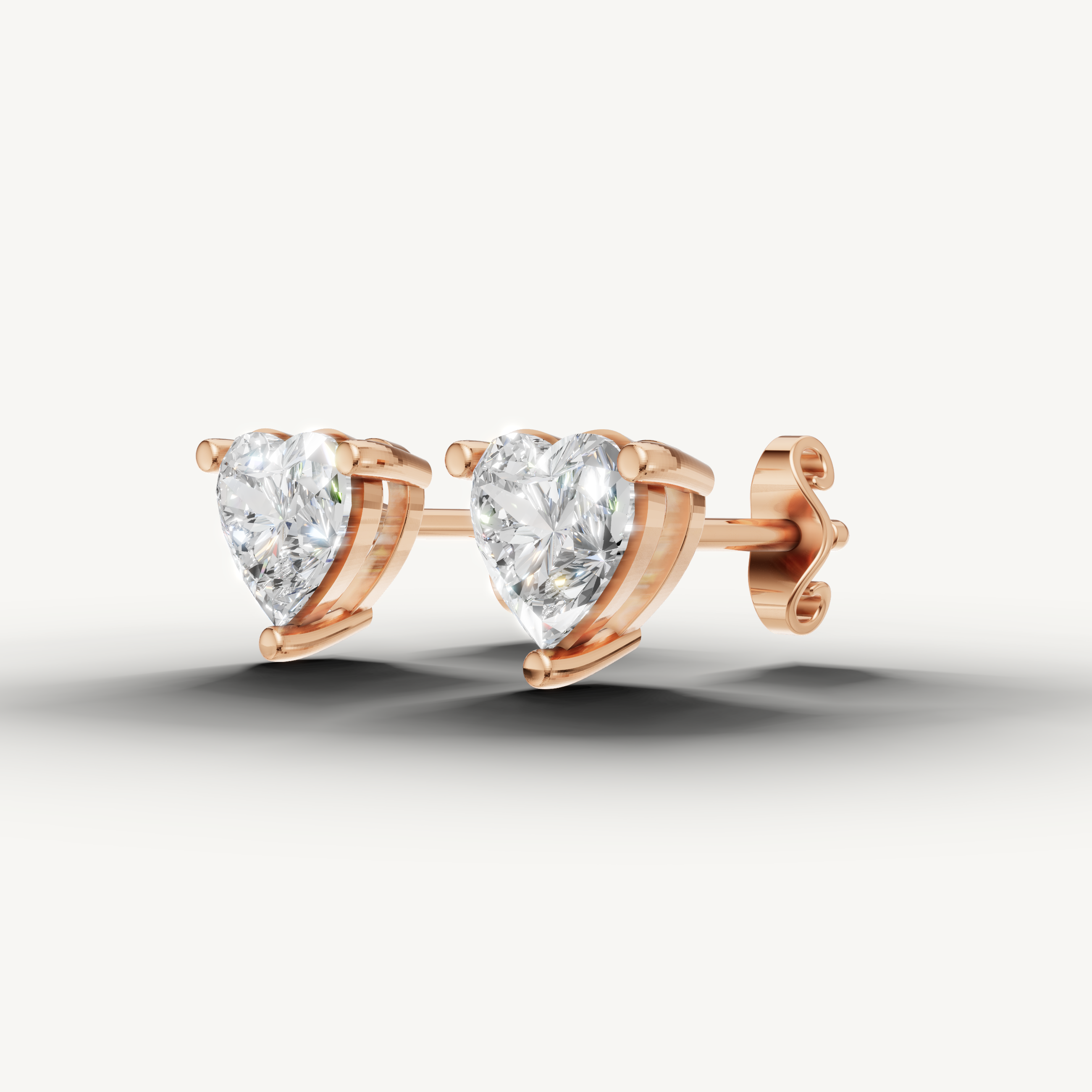 Raul Diamonds rose gold solitaire heart diamond earrings with modern luxury styling