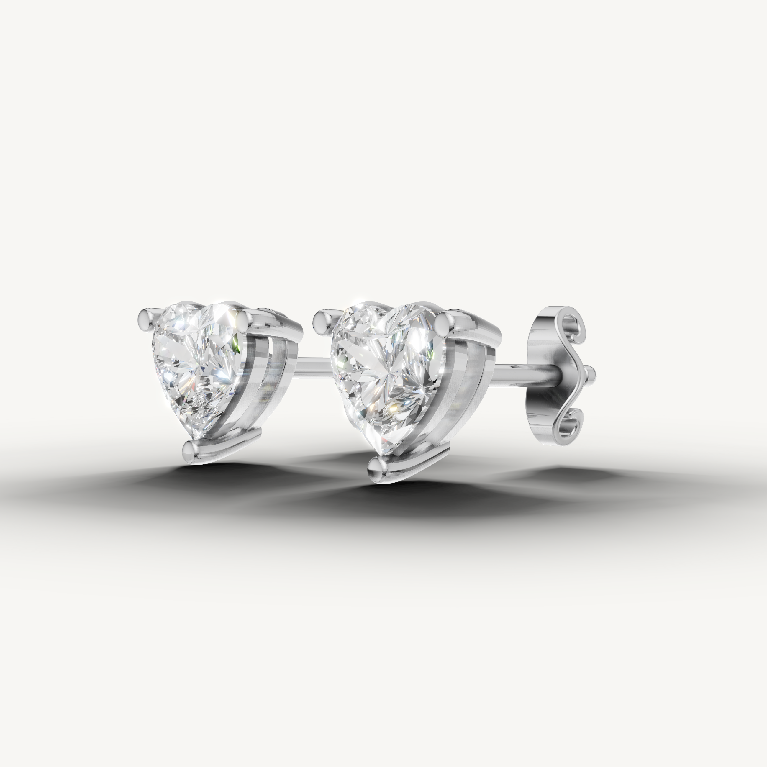 Raul Diamonds white gold solitaire heart diamond earrings with refined fine jewelry design