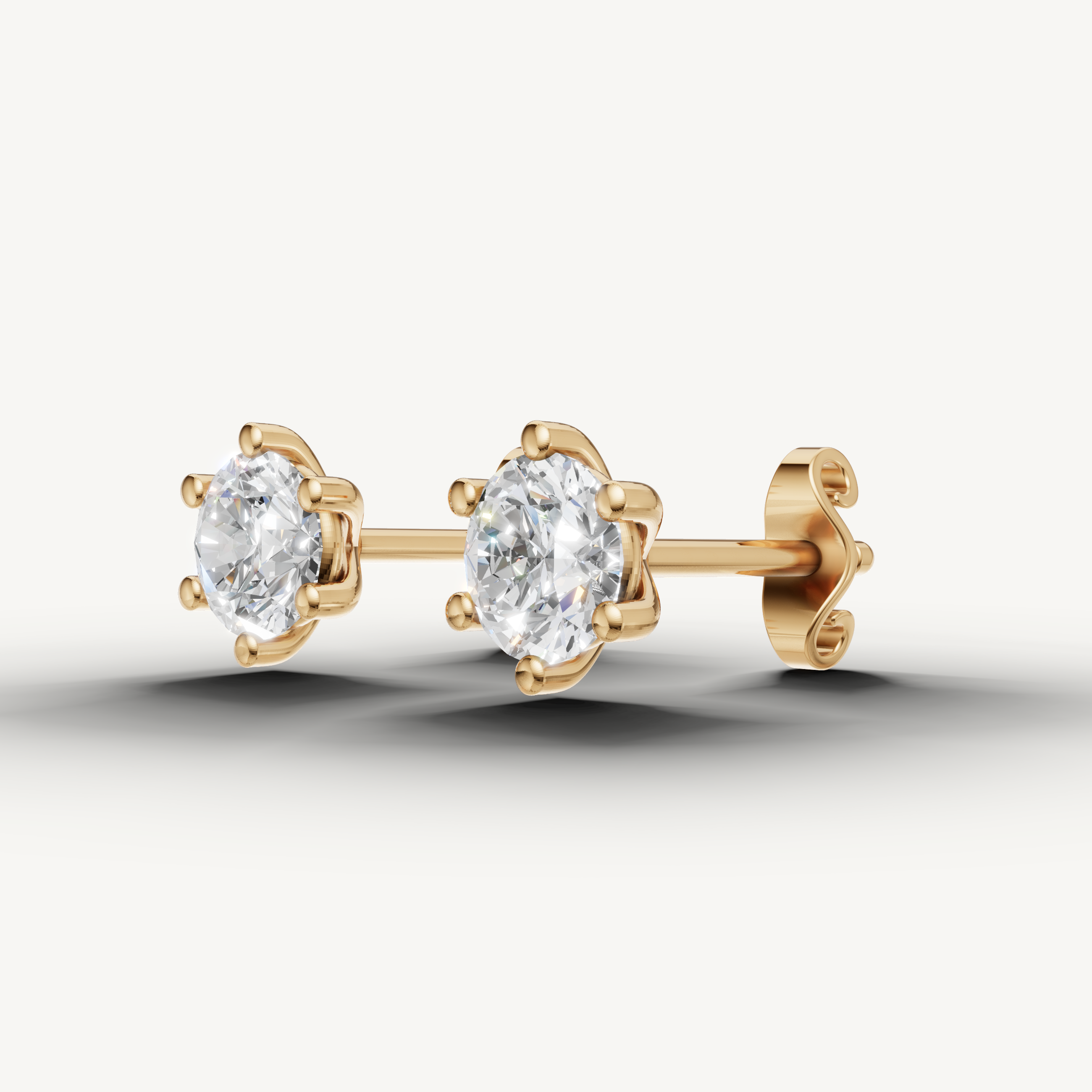 Raul Diamonds yellow gold six prong diamond stud earrings with brilliant round solitaire diamonds