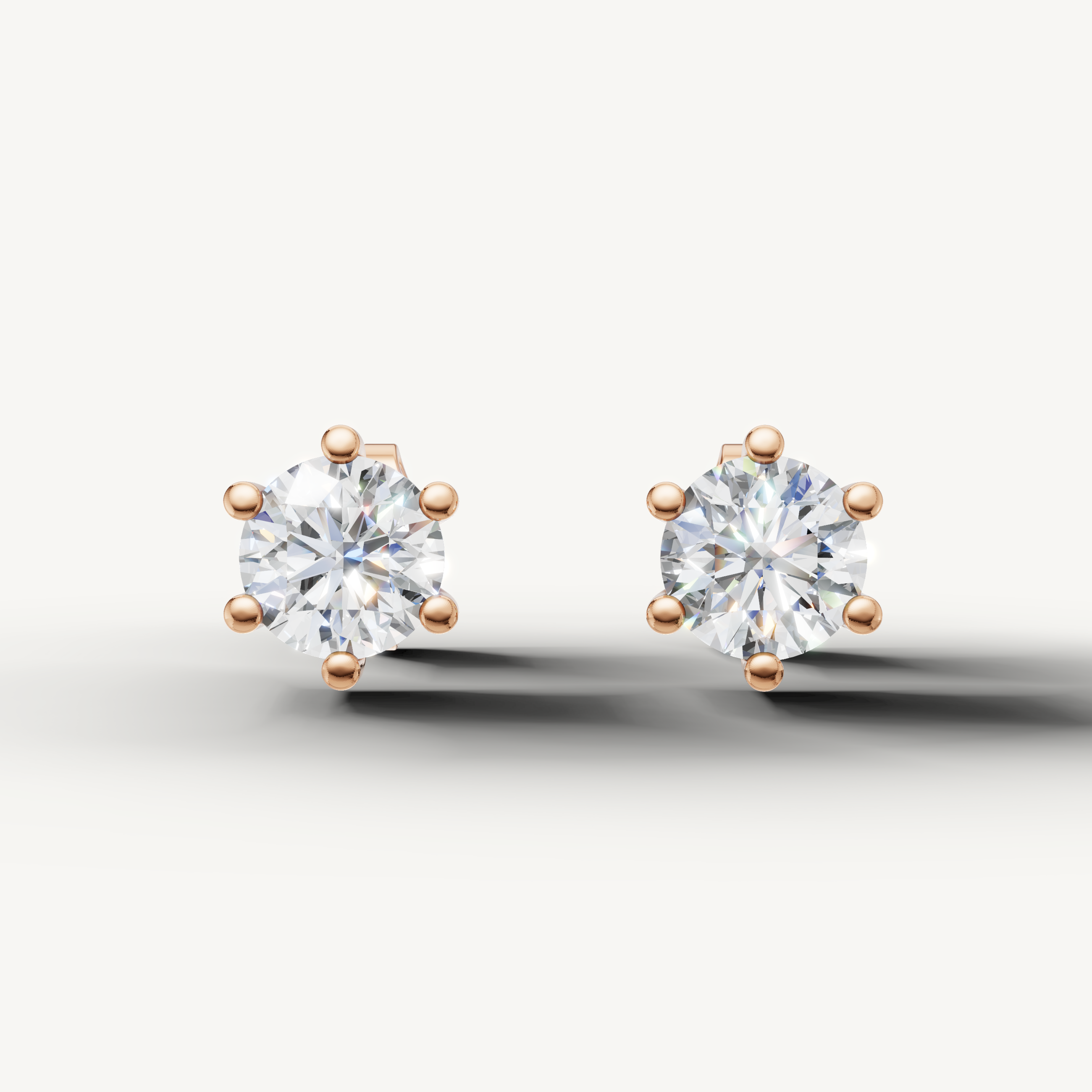 Raul Diamonds rose gold round diamond stud earrings with elegant six prong solitaire design
