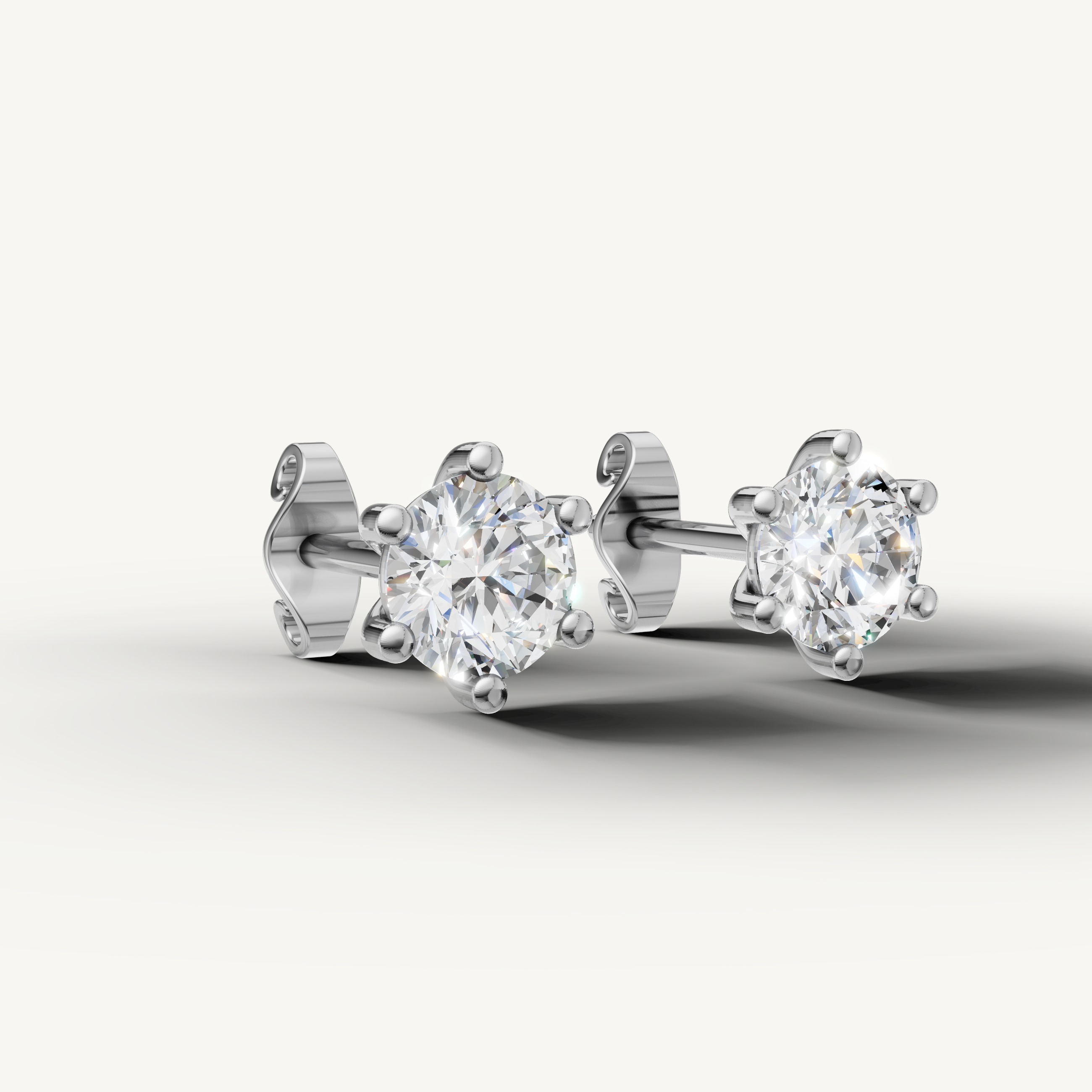 Luxury white gold round cut diamond earrings for women with elegant fine jewelry design by Raul Diamonds