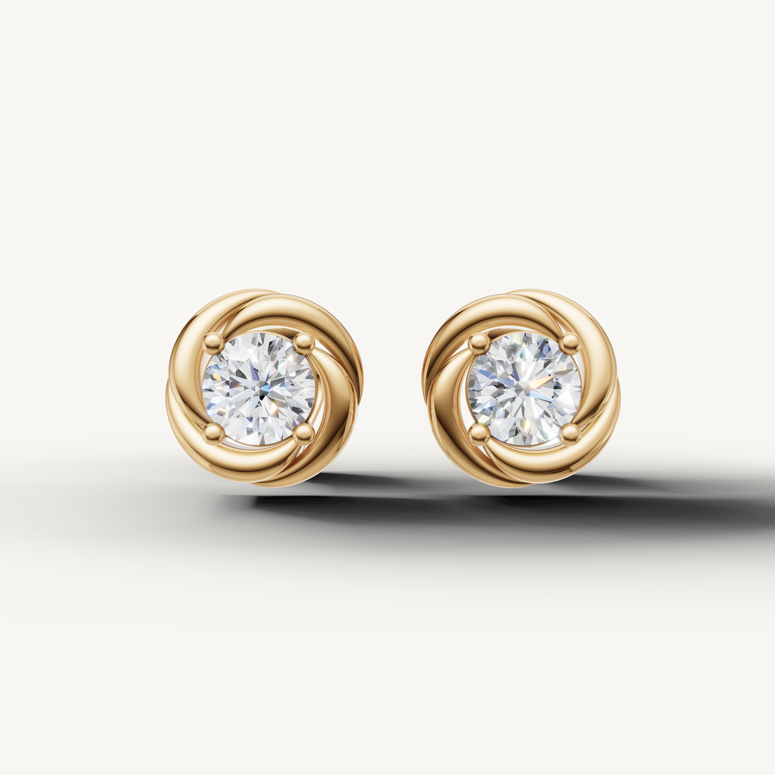 Raul Diamonds yellow gold swirl halo diamond stud earrings with round brilliant center stones
