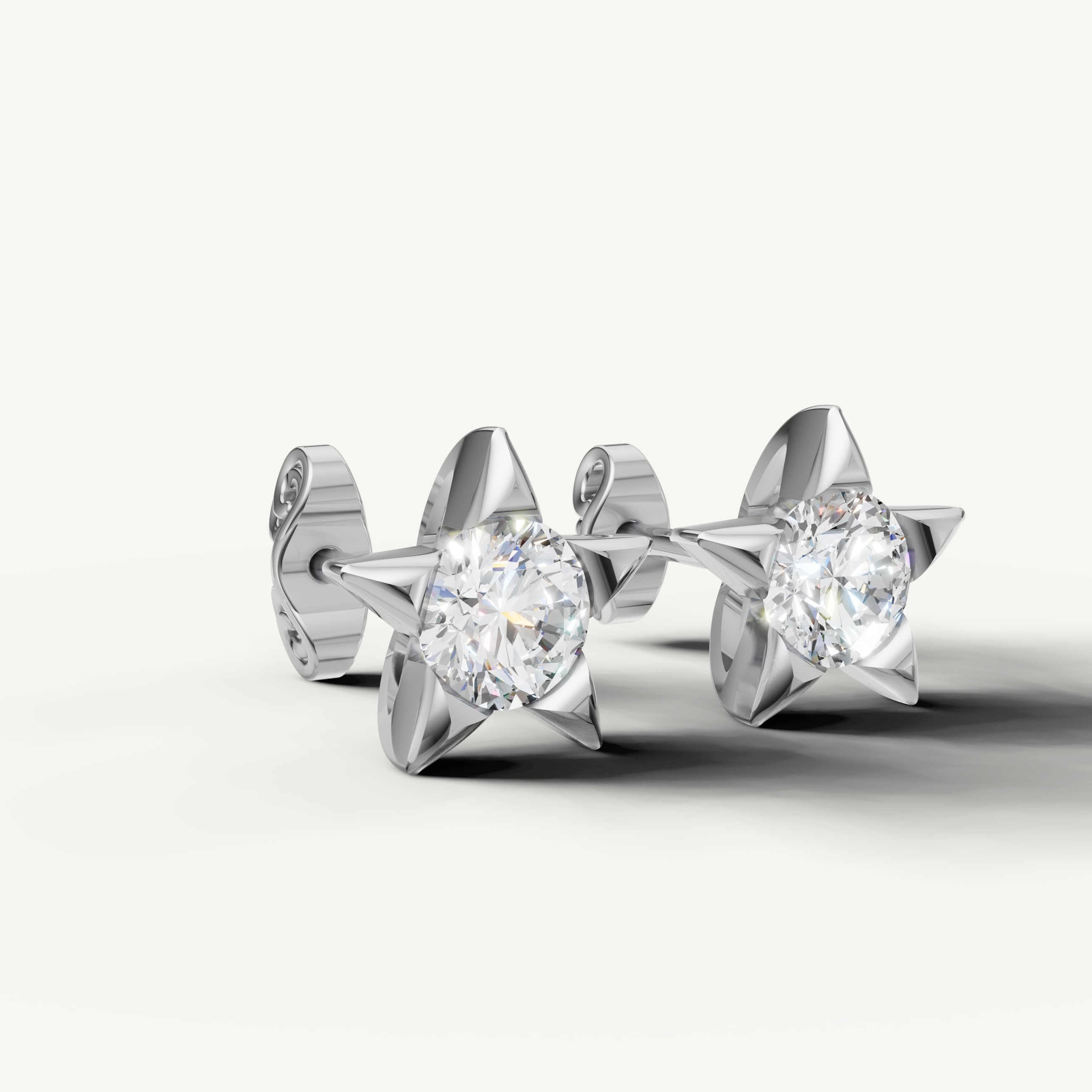 White gold round diamond star earrings by Raul Diamonds with timeless brilliance