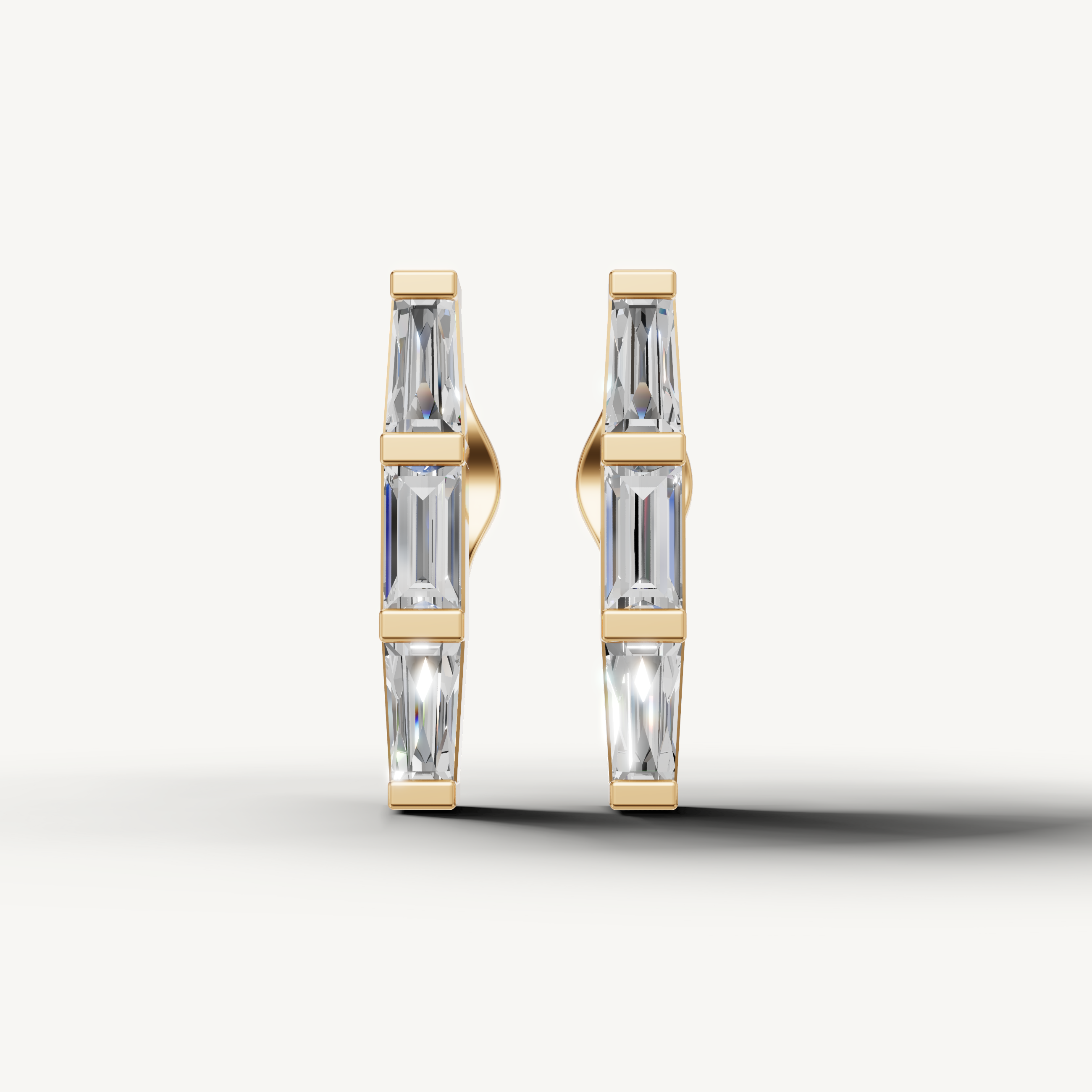 Raul Diamonds yellow gold baguette diamond hoop earrings with sleek modern elegance