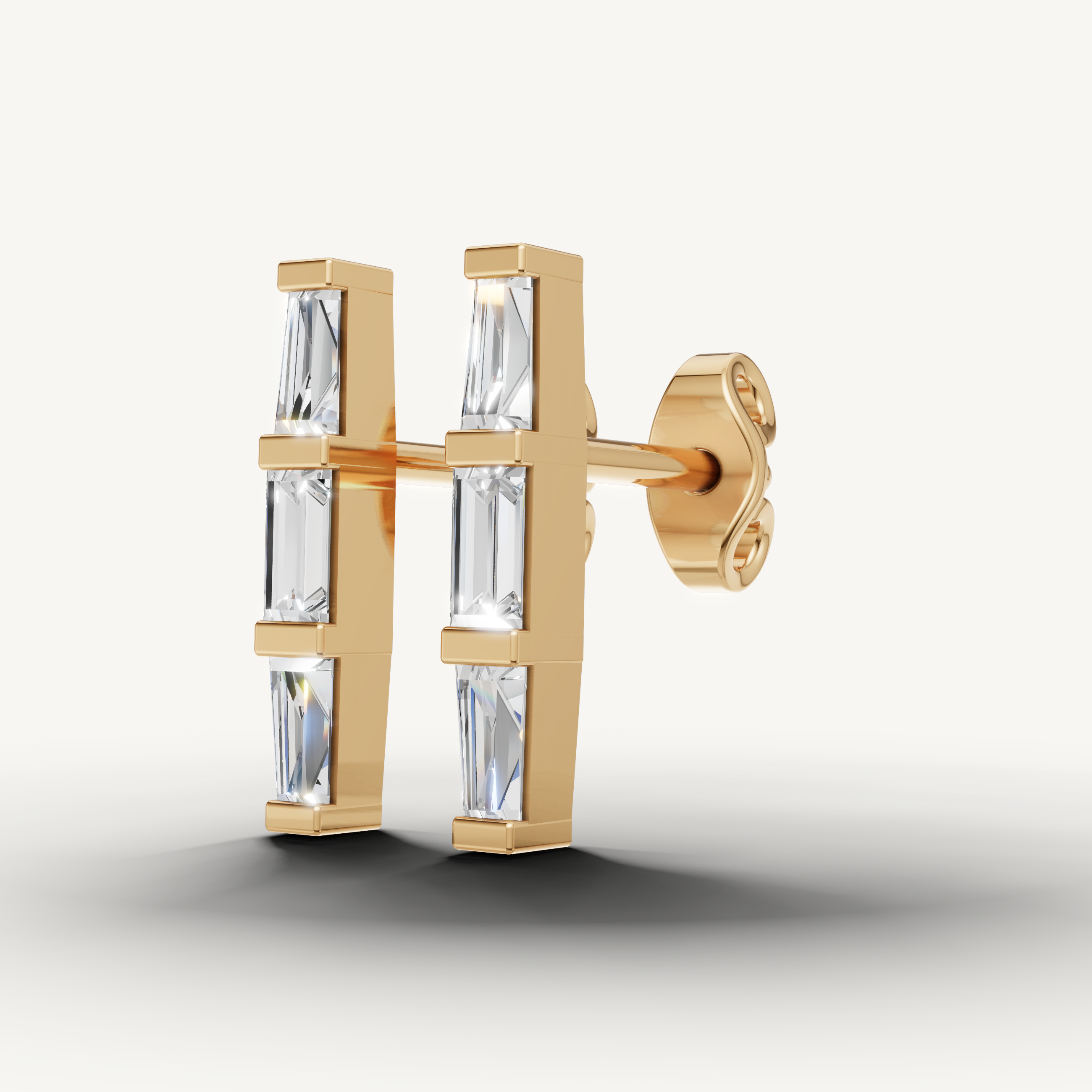 Elegant yellow gold baguette cut diamond earrings with contemporary style by Raul Diamonds