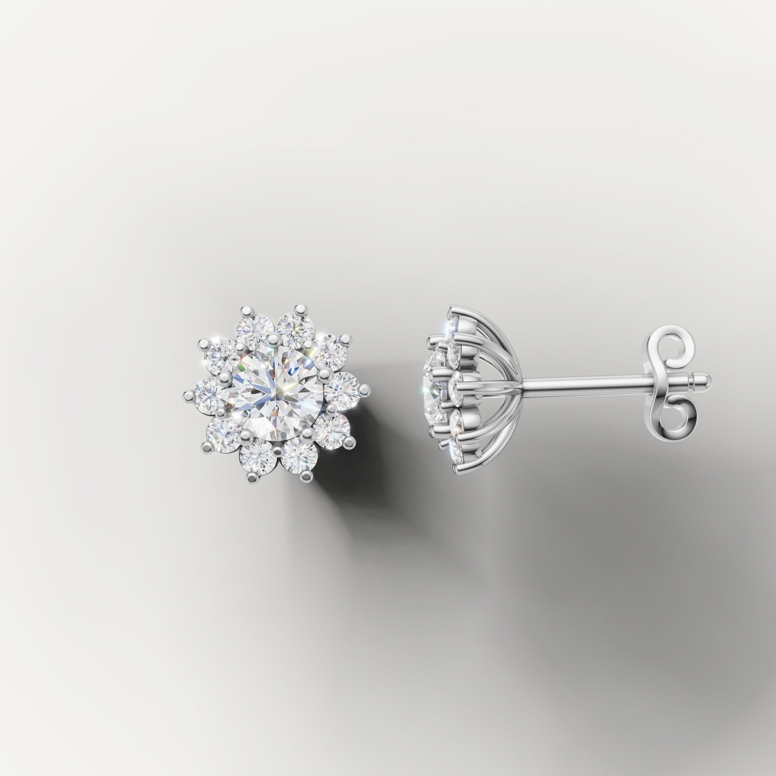 White gold flower diamond earrings by Raul Diamonds with sparkling round diamonds