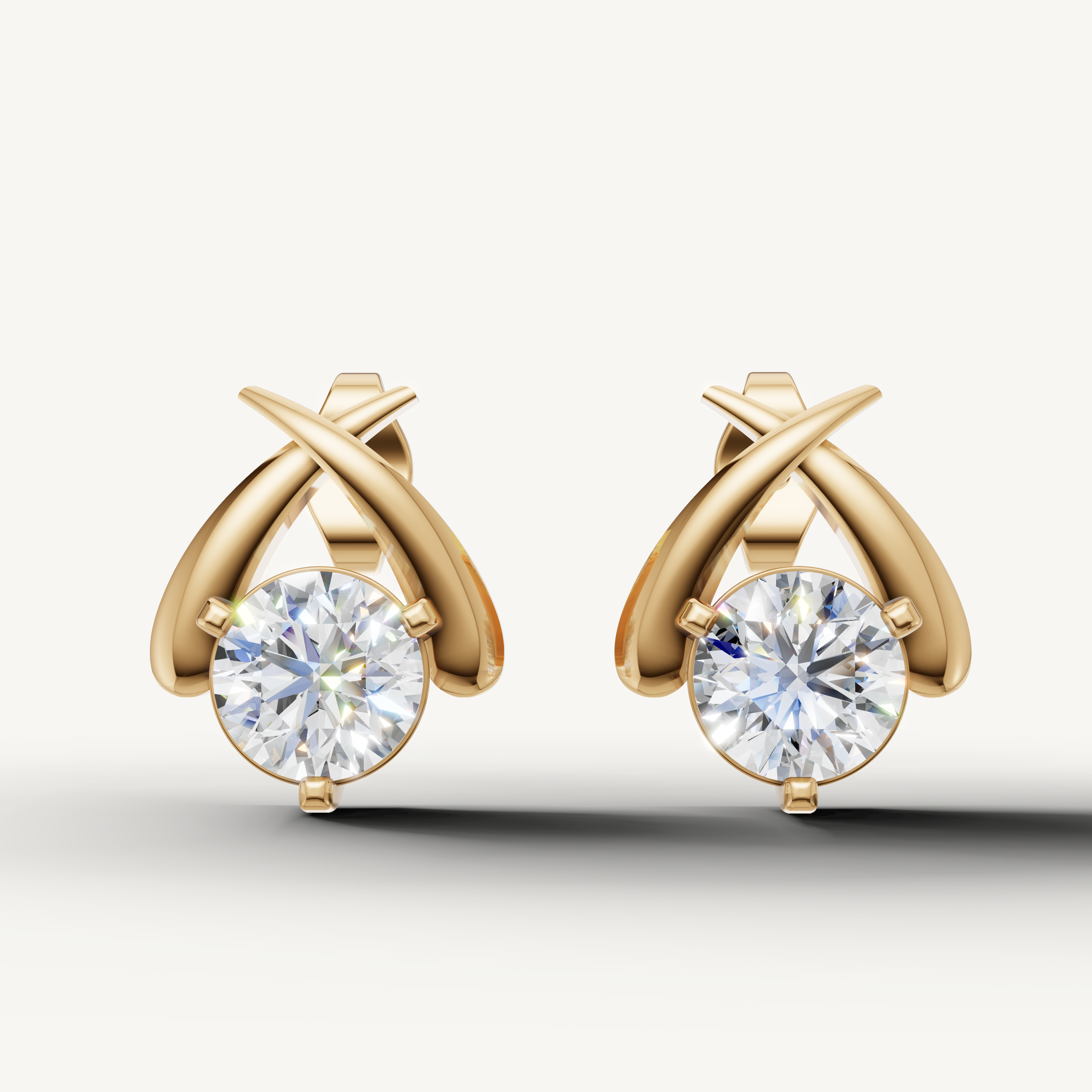 Raul Diamonds yellow gold crossover diamond stud earrings with modern luxury sparkle
