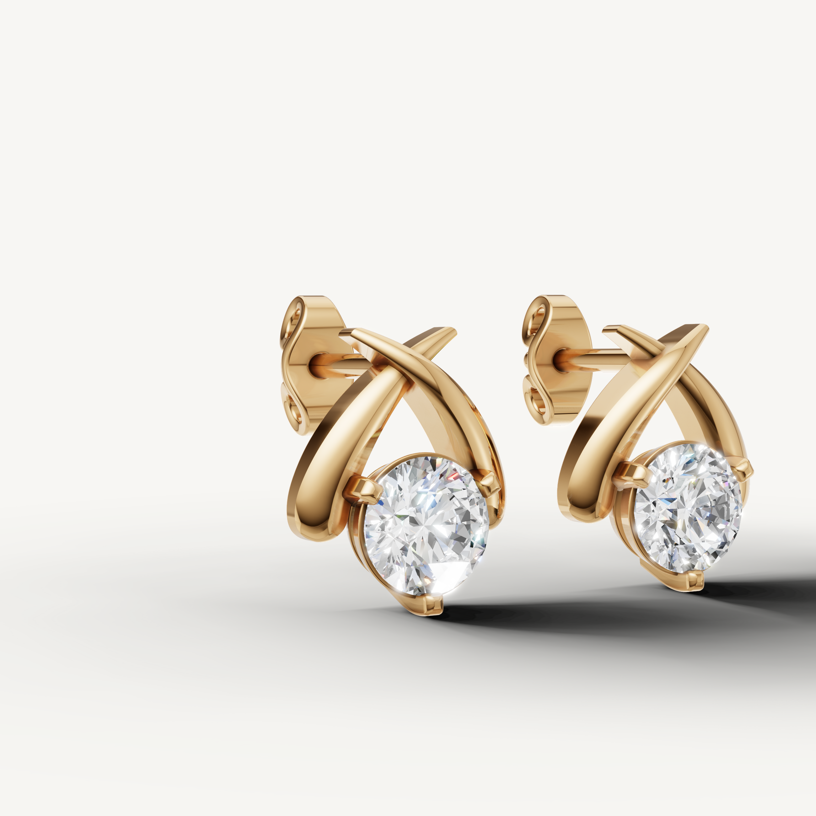 Elegant yellow gold criss cross diamond earrings with radiant sparkle by Raul Diamonds