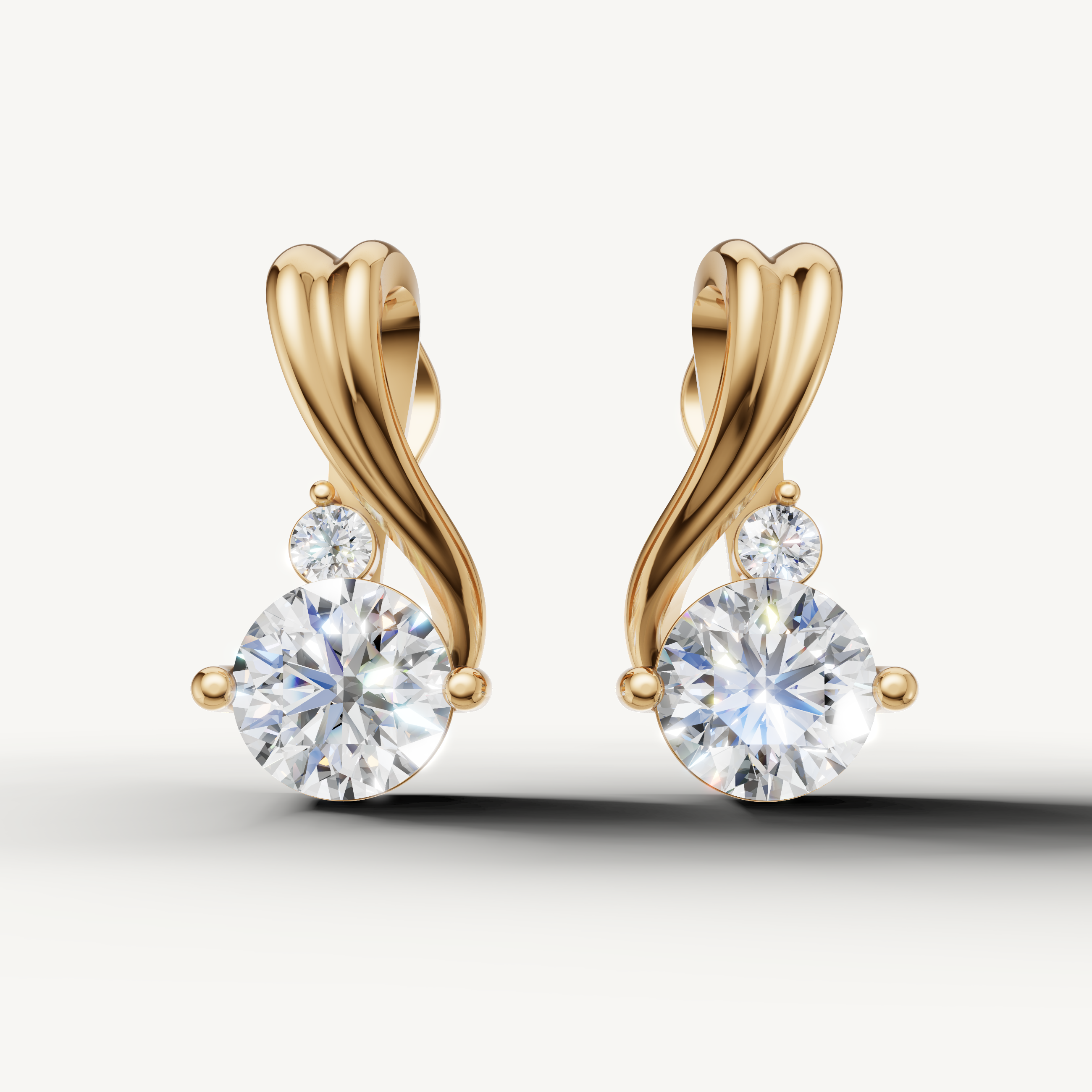 Twisted drop lab grown diamond earrings in 14K yellow gold by Raul Diamonds