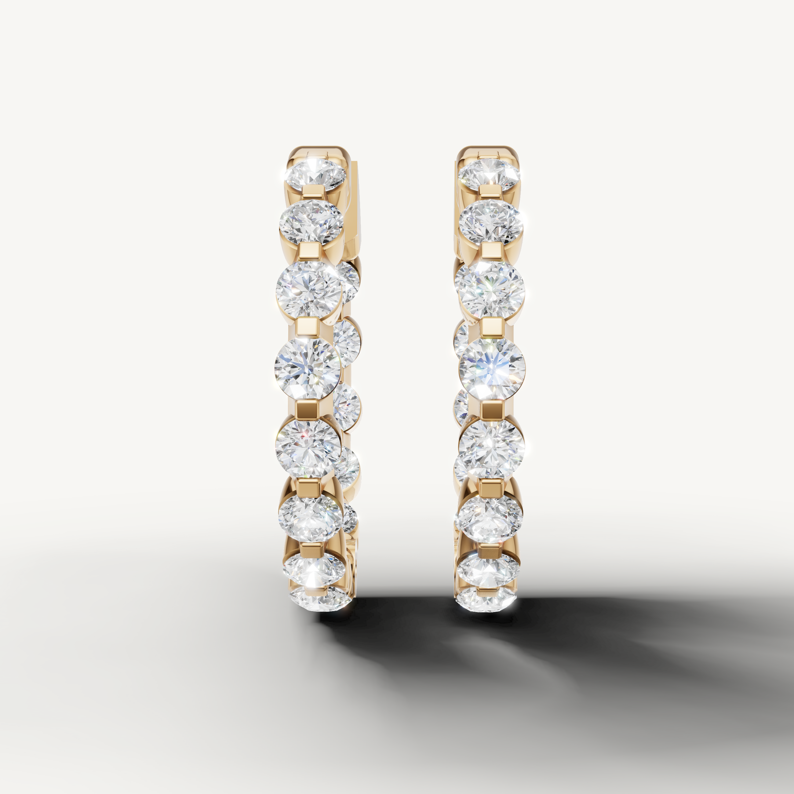 Raul Diamonds yellow gold diamond hoop earrings with round brilliant stones