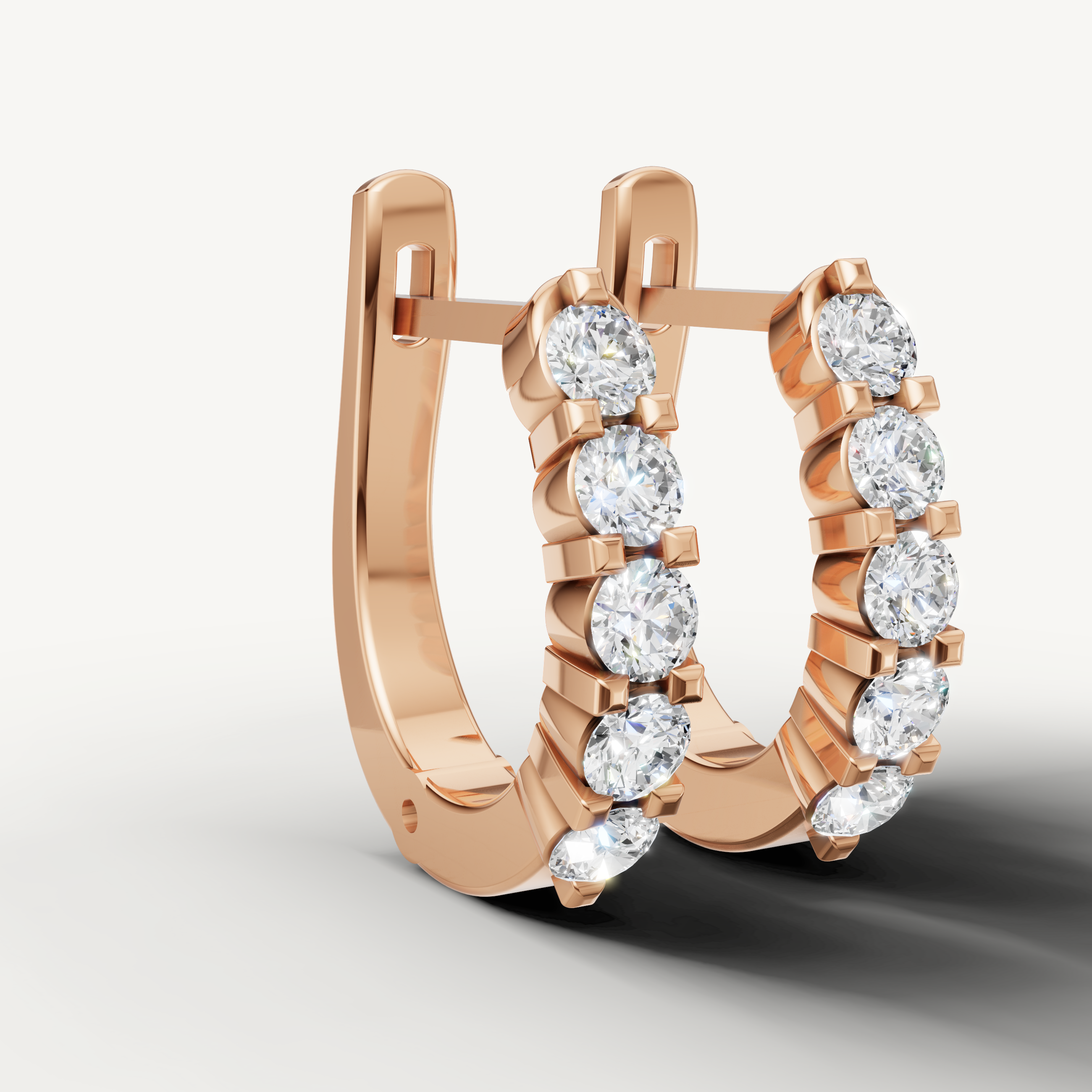 Rose gold diamond hoop earrings by Raul Diamonds with luxury sparkle finish