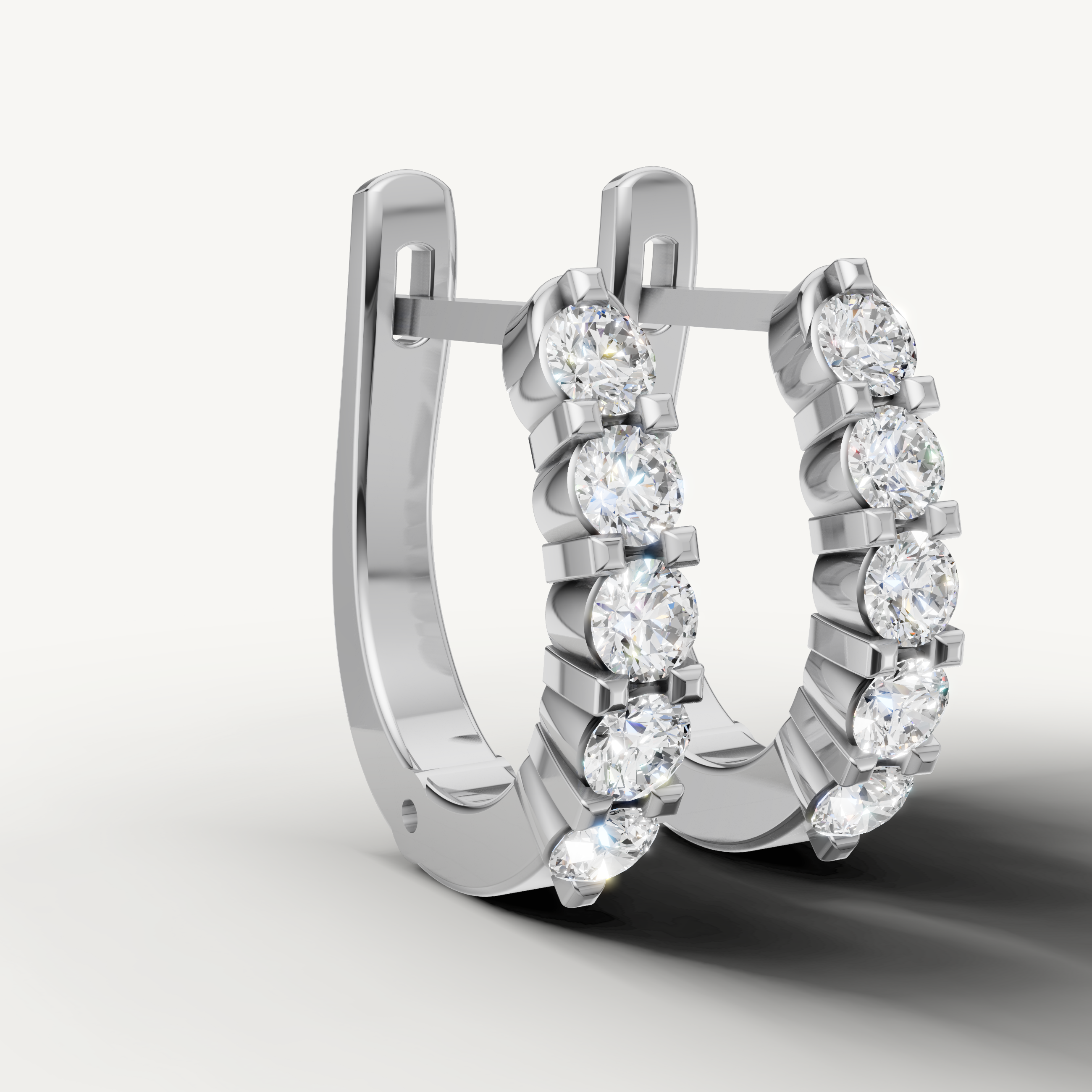 White gold diamond hoop earrings by Raul Diamonds with radiant luxury sparkle