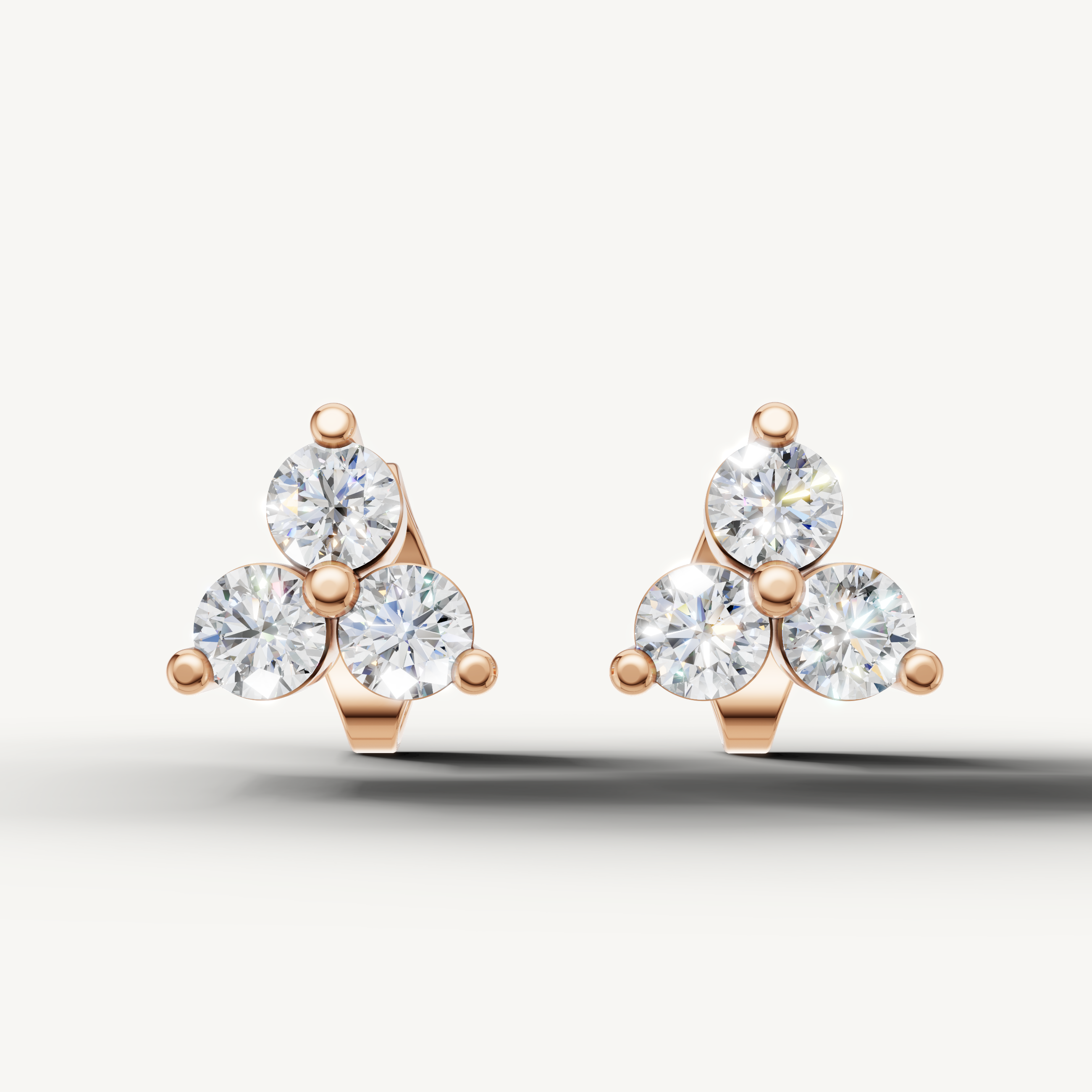 Raul Diamonds rose gold three stone diamond stud earrings with brilliant sparkle