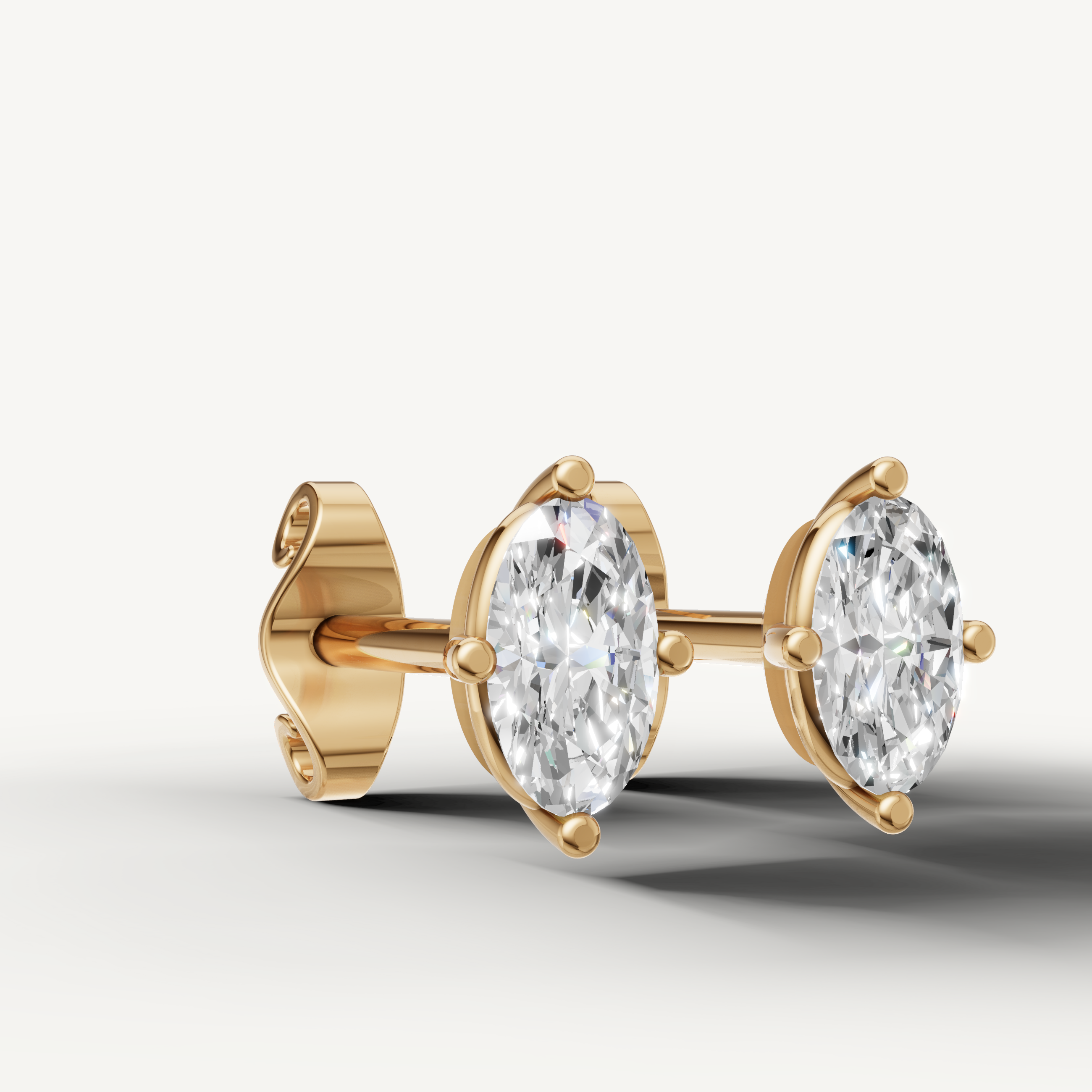 Luxury yellow gold solitaire stud earrings with marquise diamonds for women by Raul Diamonds