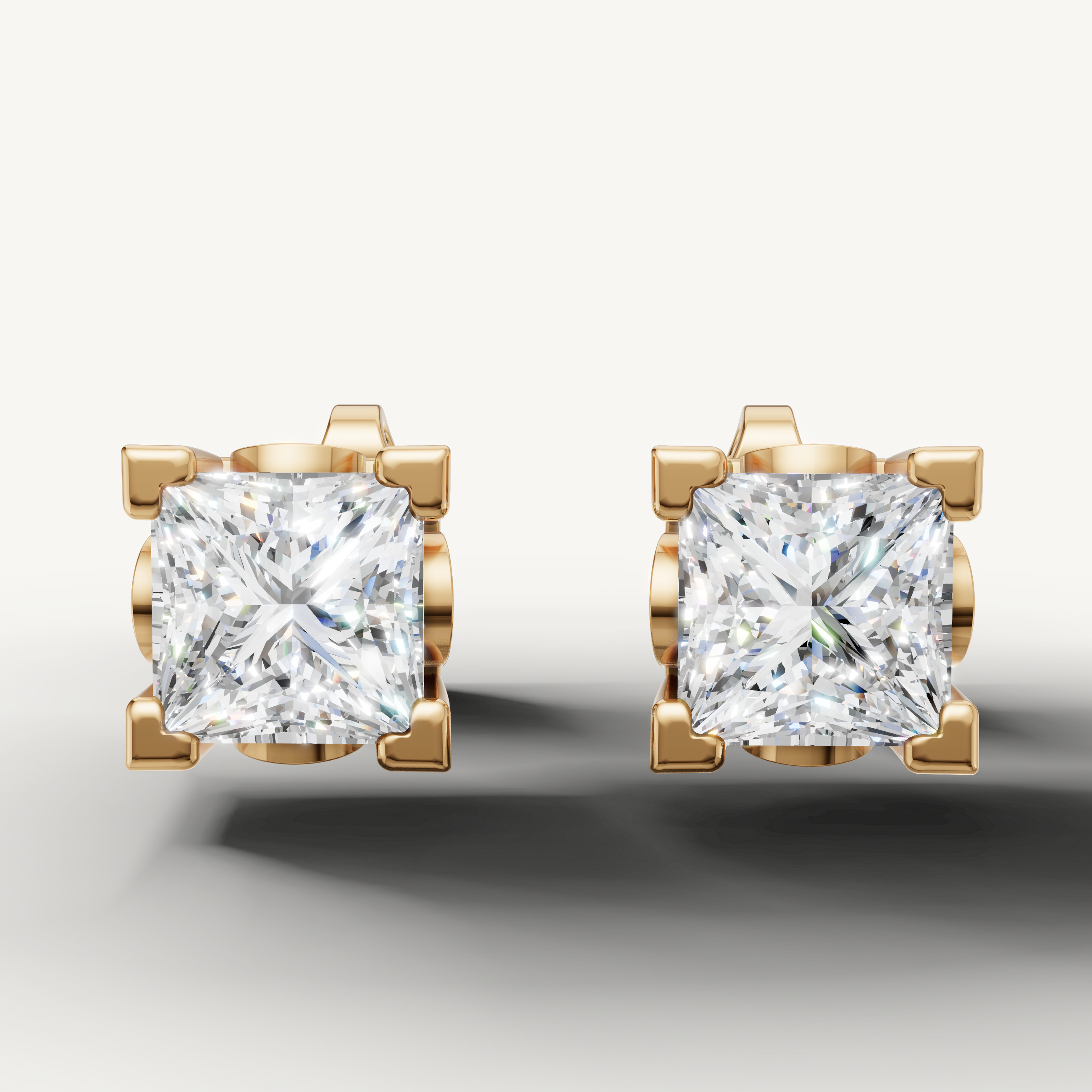 Princess cut lab grown diamond stud earrings in 14K yellow gold by Raul Diamonds