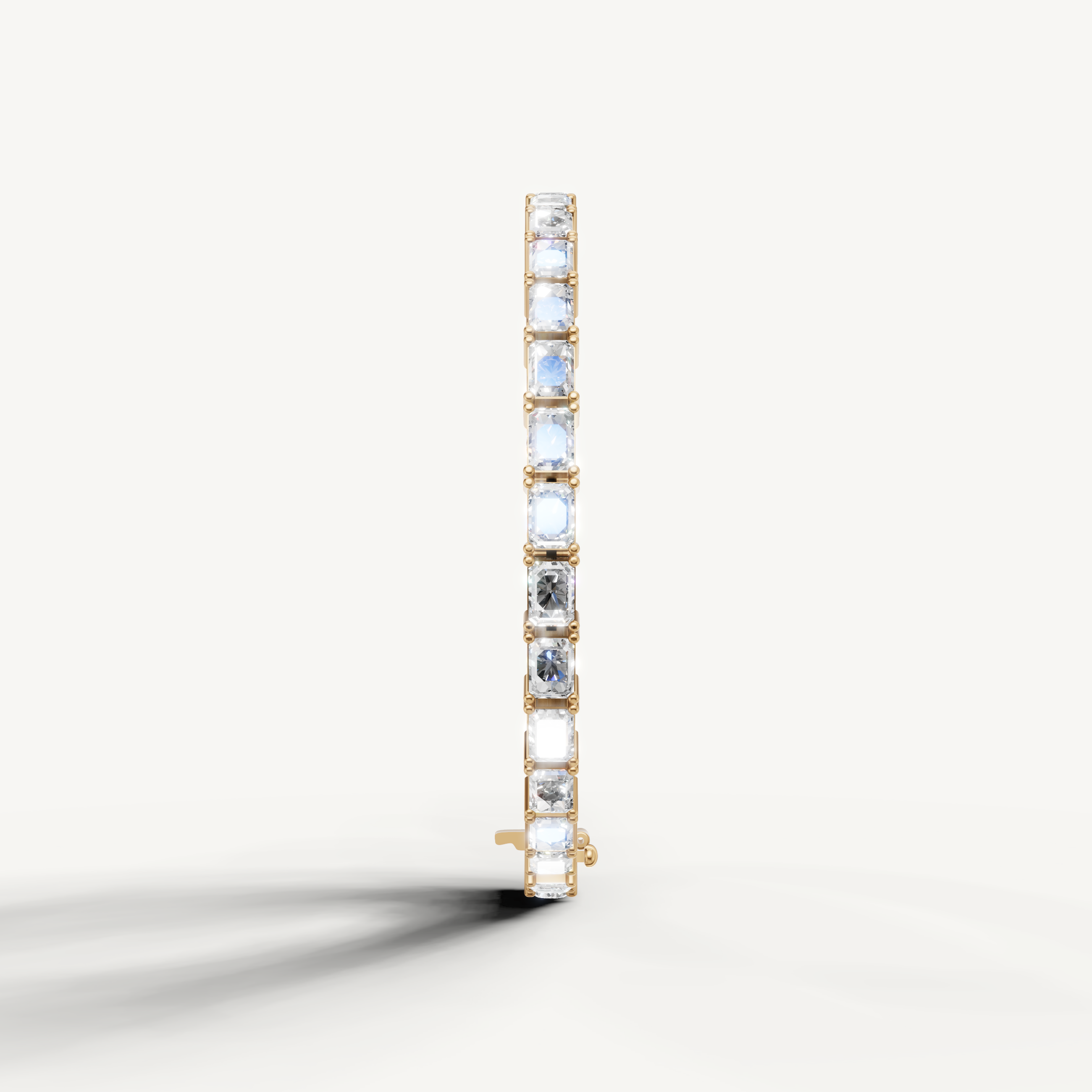Luxury yellow gold diamond bracelet with alternating round and radiant cut stones by Raul Diamonds