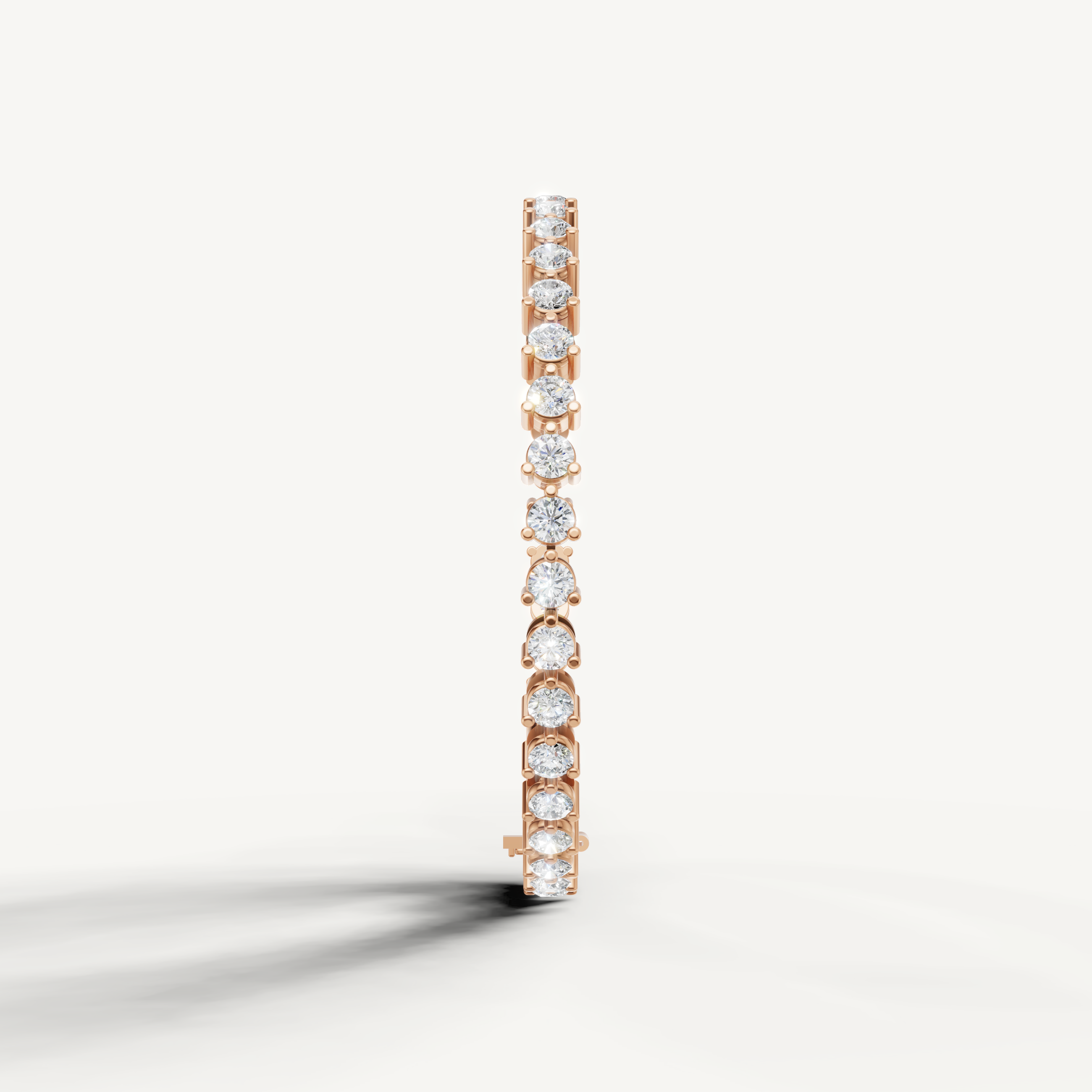 Elegant rose gold diamond tennis bracelet with alternating pear and round diamonds