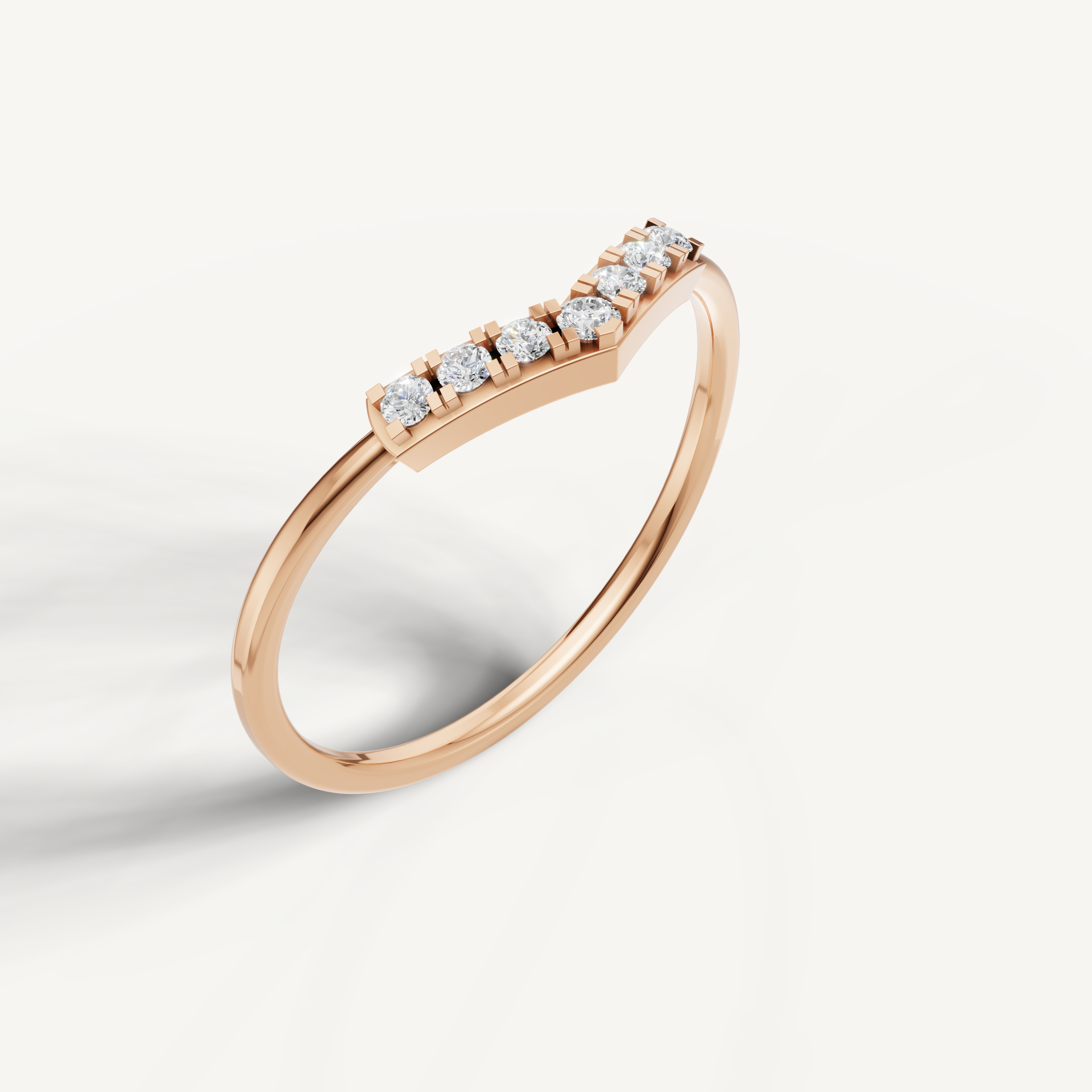 Rose gold chevron wedding ring featuring delicate pavé set diamonds for women