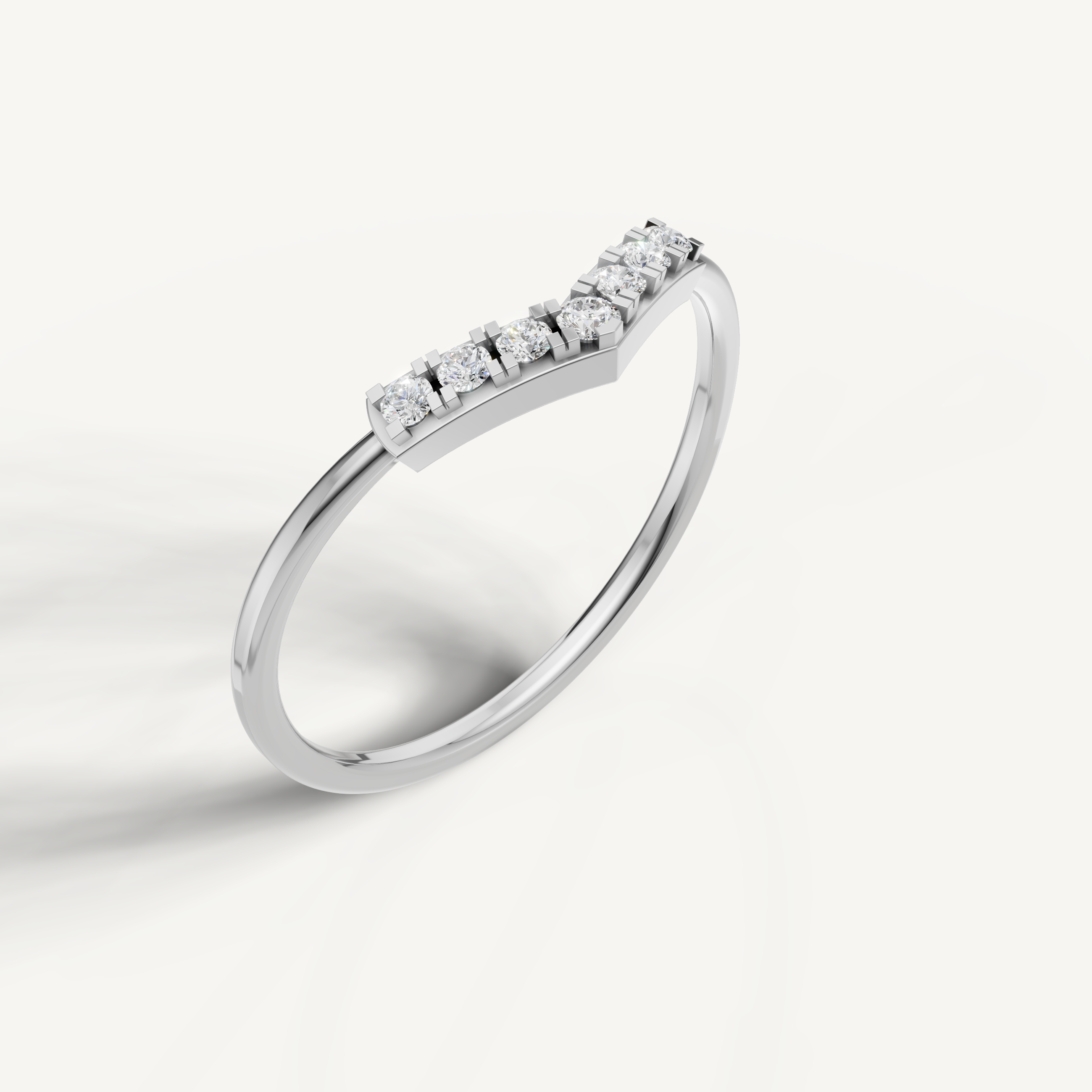 White gold chevron diamond wedding ring with elegant curved minimalist design