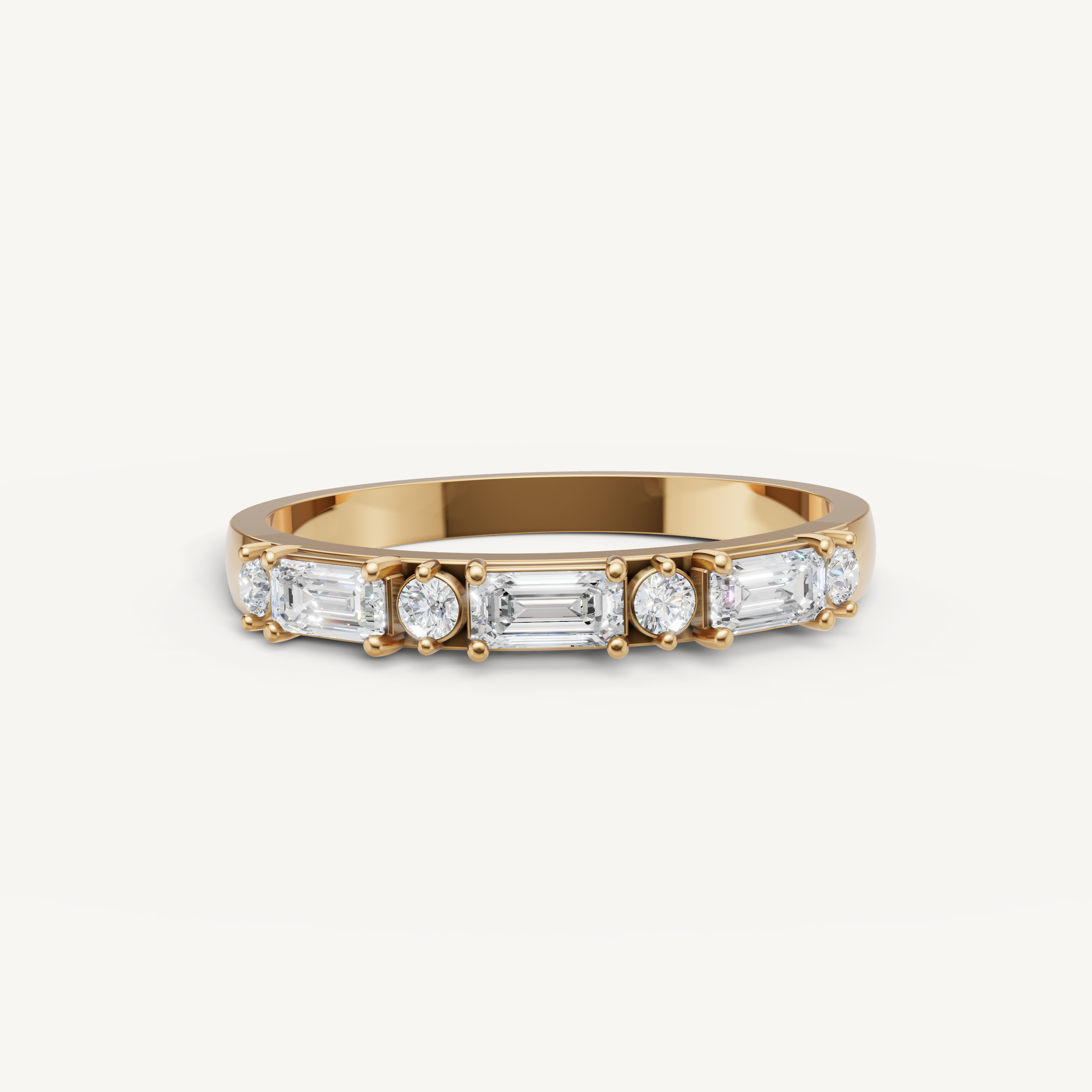 Raul Diamonds yellow gold emerald and round diamond wedding band with shared prong setting