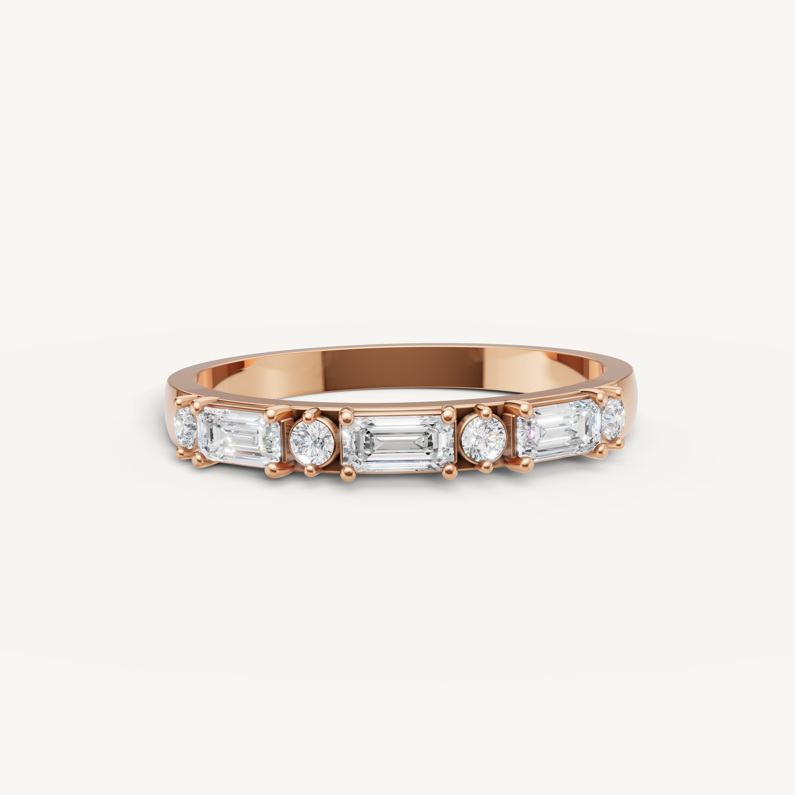 Raul Diamonds rose gold emerald and round diamond wedding band with brilliant sparkle