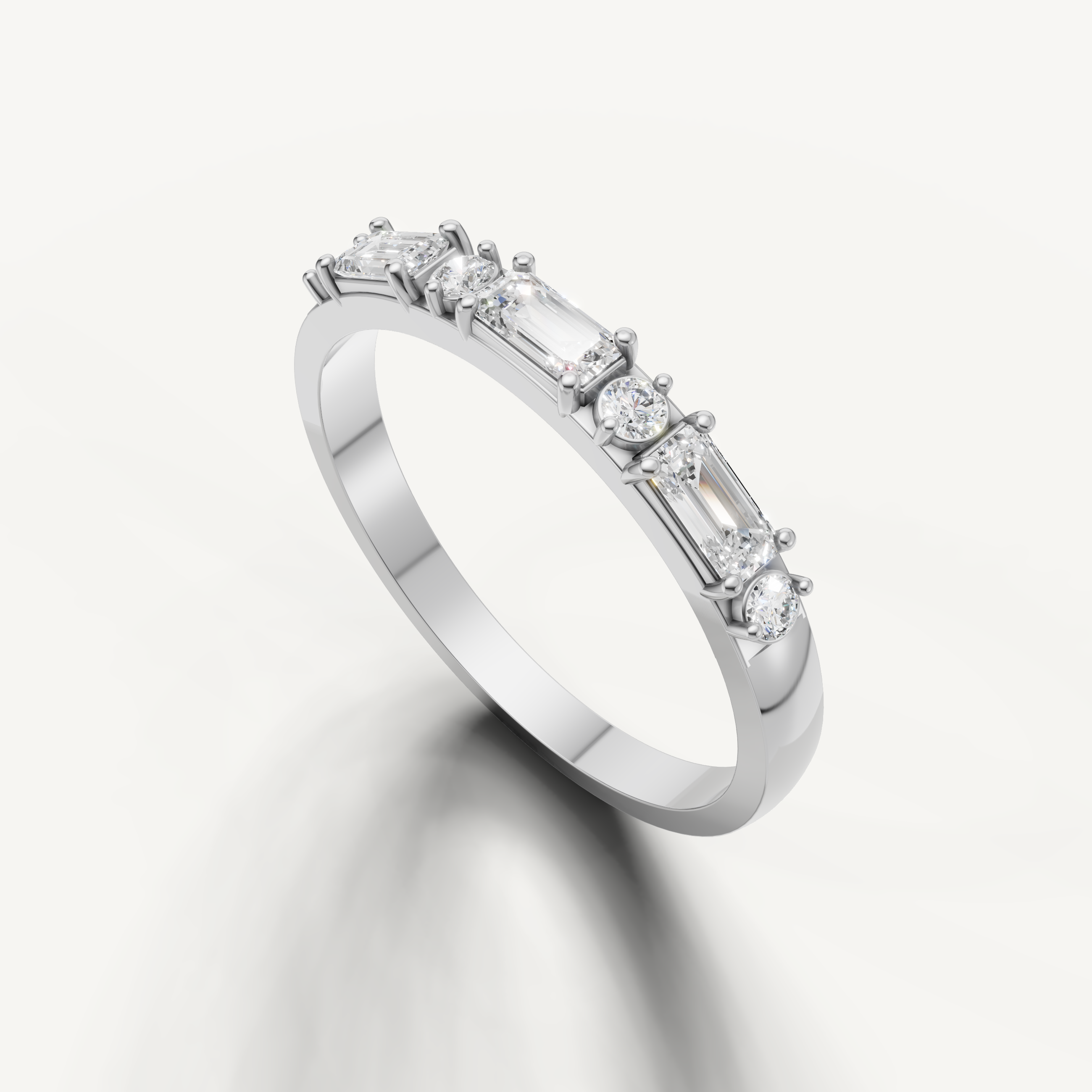 Modern white gold stackable wedding band with alternating baguette and round diamonds