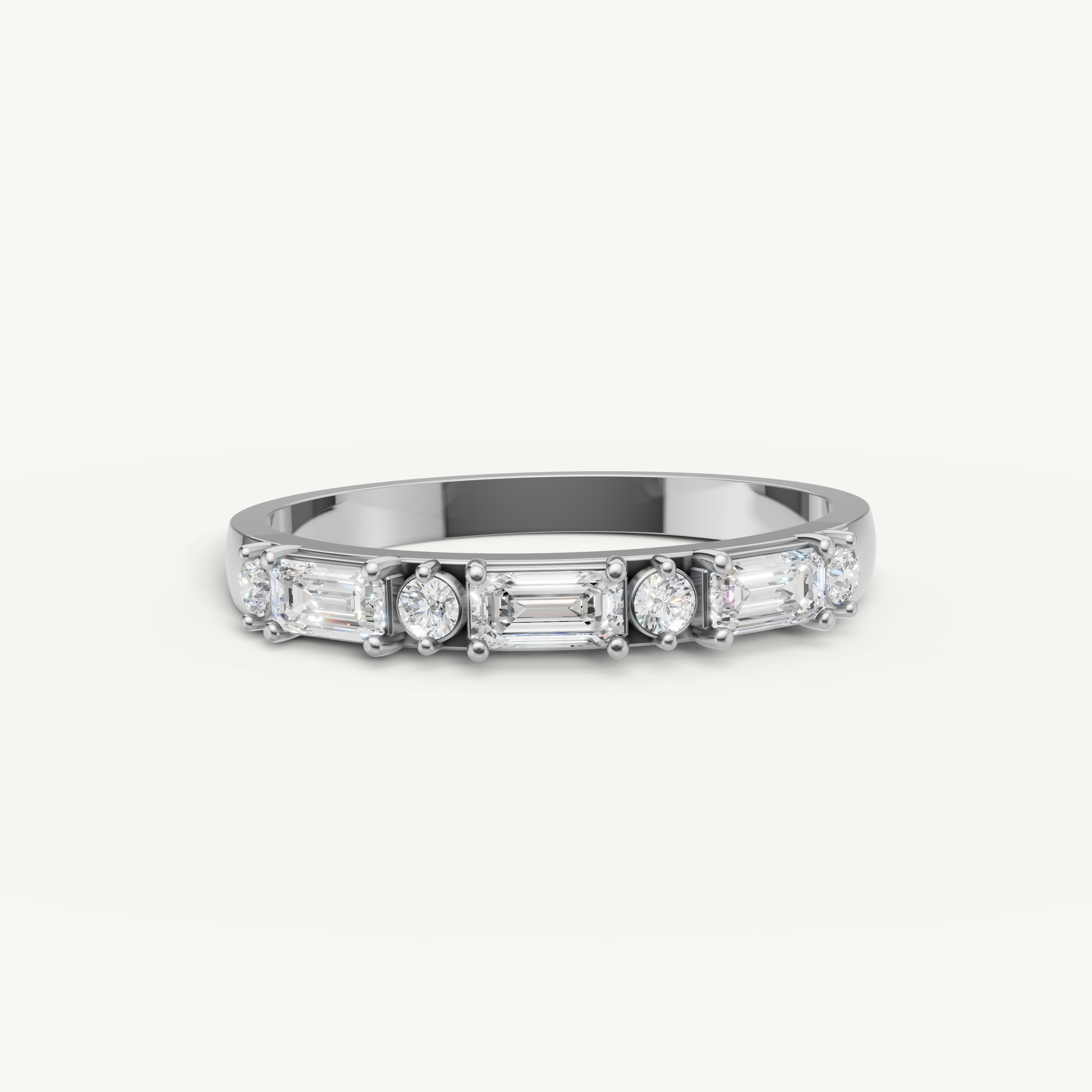 Raul Diamonds white gold emerald and round diamond wedding band with timeless elegance