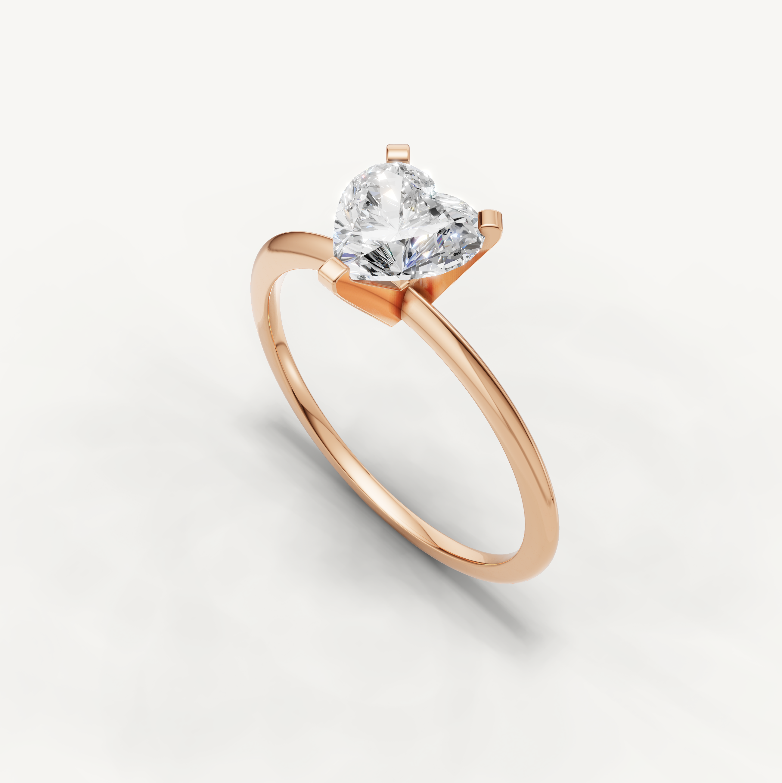 Thin band heart cut solitaire ring in rose gold by Raul Diamonds