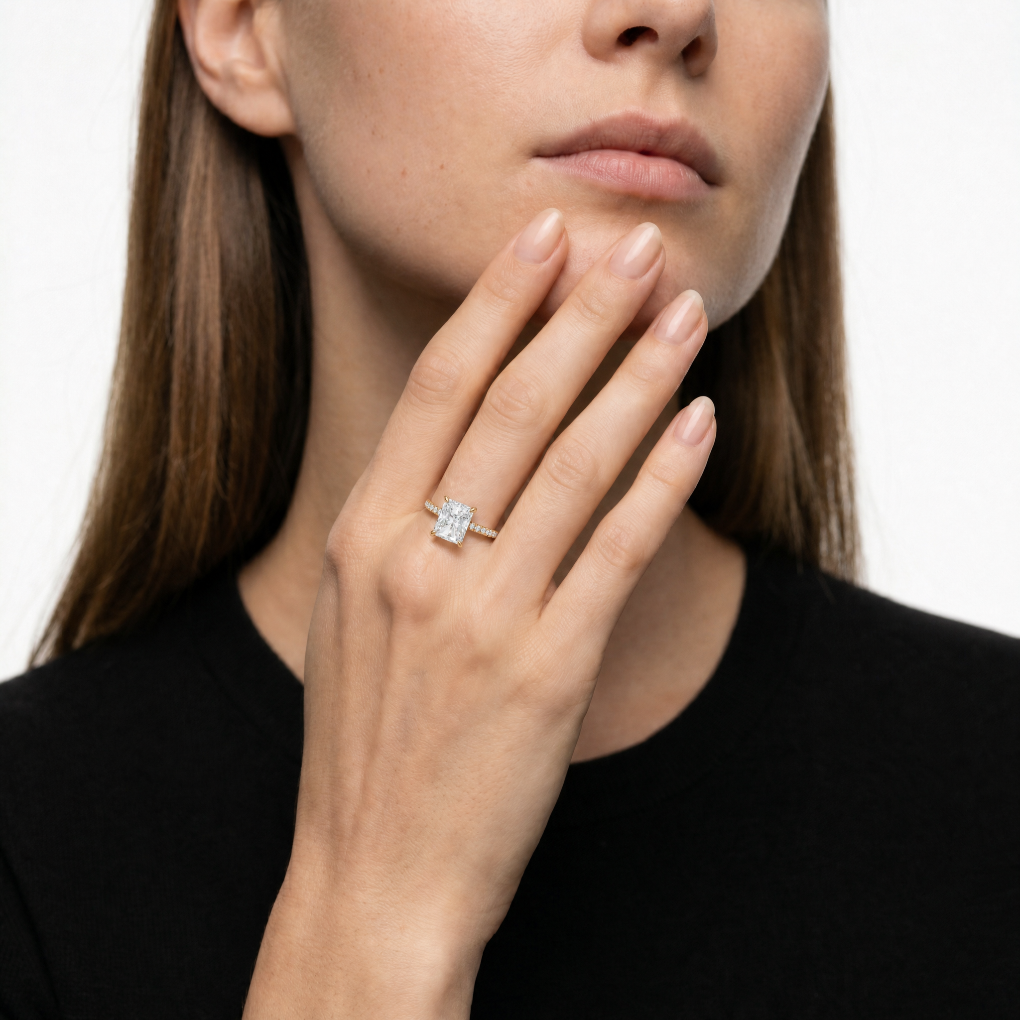 Elegant Model Wearing Radiant Cut Lab Grown Diamond Engagement Ring in 14K Yellow Gold – Raul Diamonds