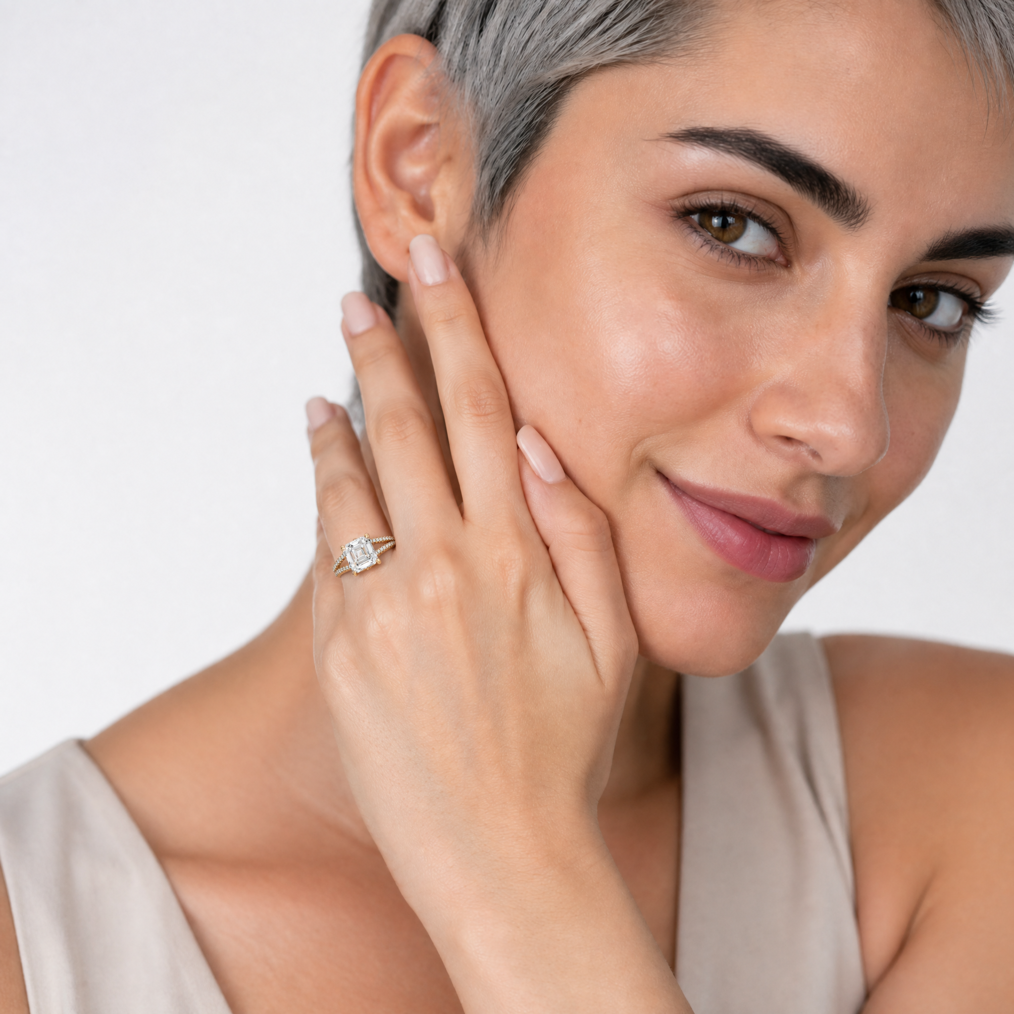 Woman Wearing Asscher Cut Lab Grown Diamond Engagement Ring in 14K Yellow Gold – Raul Diamonds