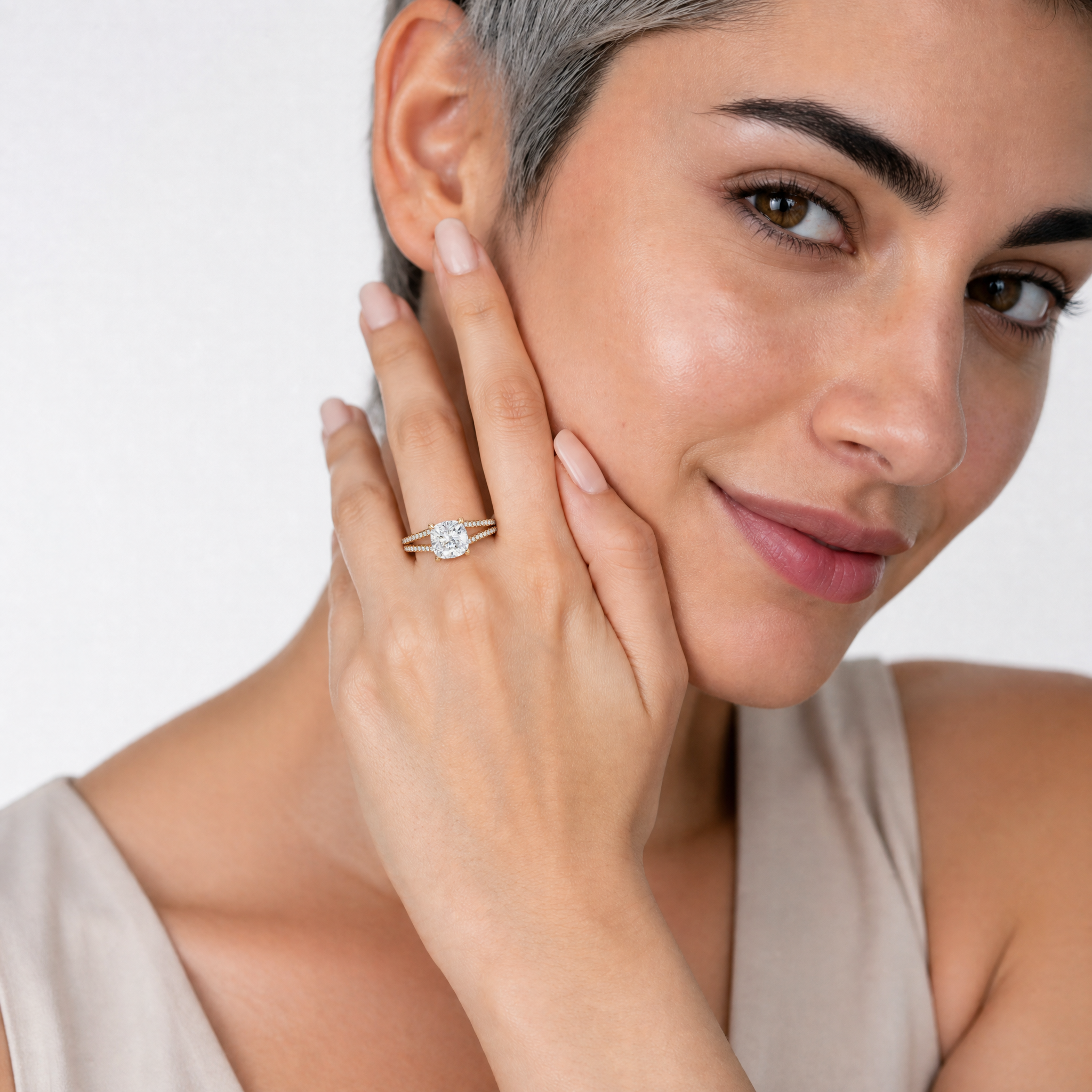 Woman Wearing Cushion Cut Lab Grown Diamond Engagement Ring in 14K Yellow Gold – Raul Diamonds