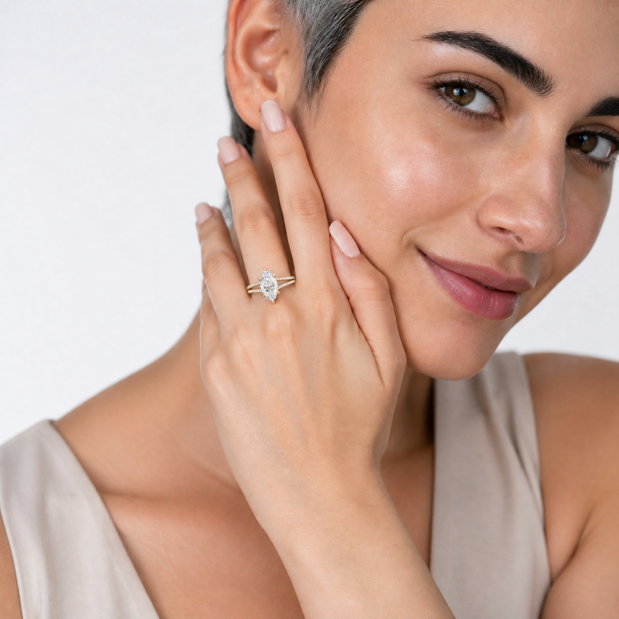 Woman Wearing Marquise Cut Lab Grown Diamond Engagement Ring in 14K Yellow Gold – Raul Diamonds