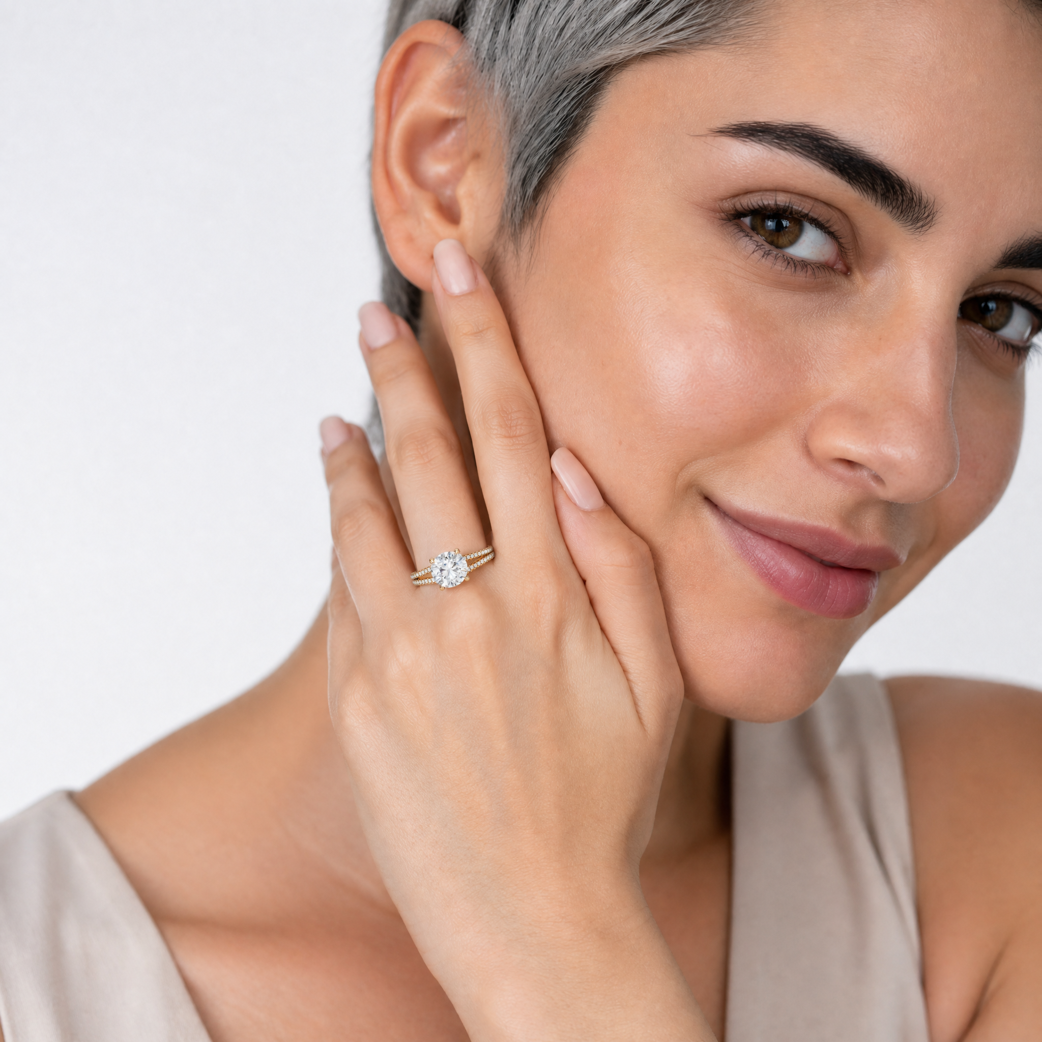 Woman Wearing Round Cut Lab Grown Diamond Engagement Ring in 14K Yellow Gold – Raul Diamonds