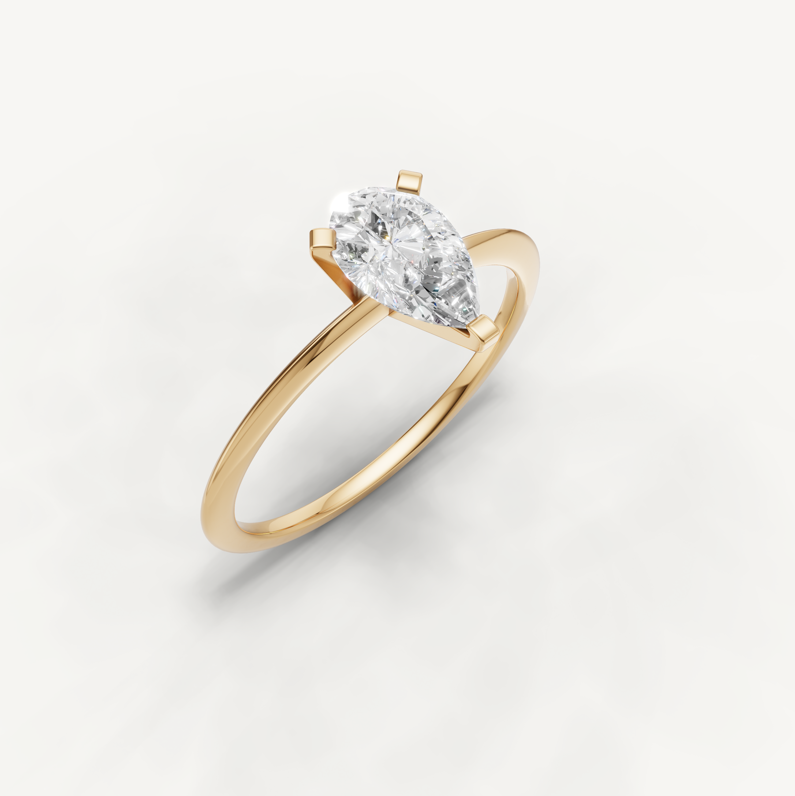 Elegant pear diamond yellow gold solitaire ring for women by Raul Diamonds