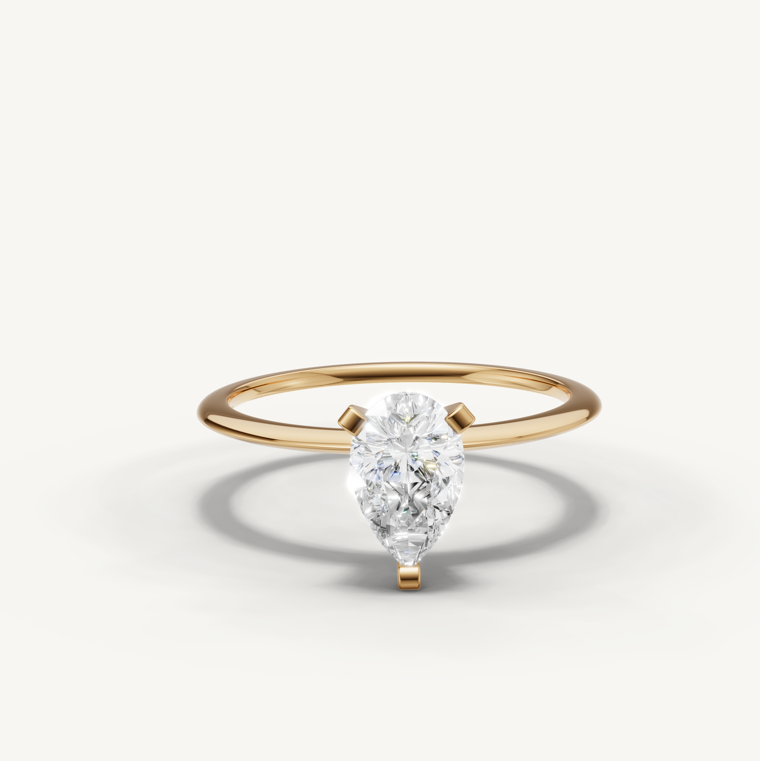 Pear cut lab grown diamond solitaire engagement ring in yellow gold by Raul Diamonds