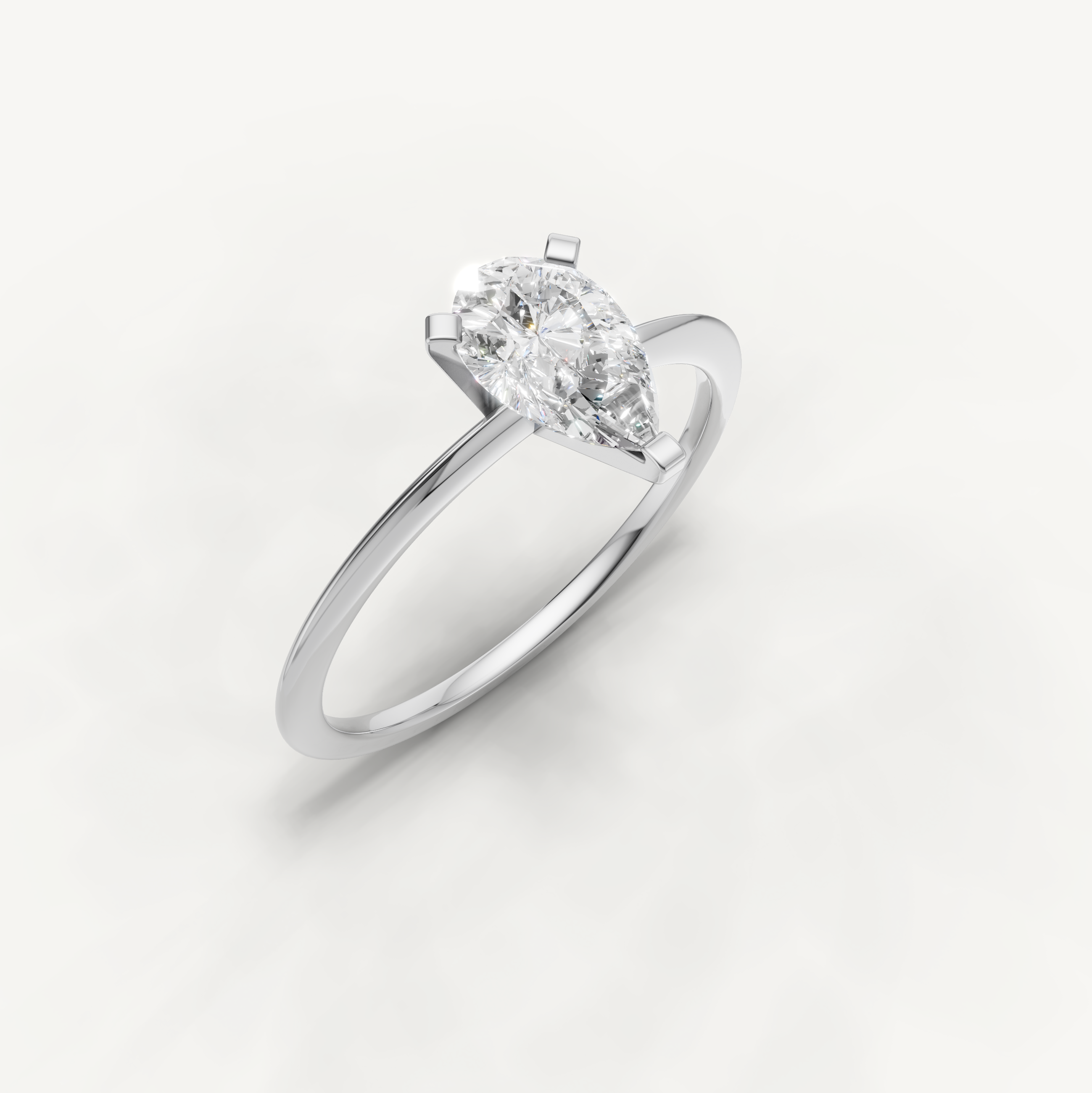 Timeless white gold pear diamond engagement ring for women by Raul Diamonds