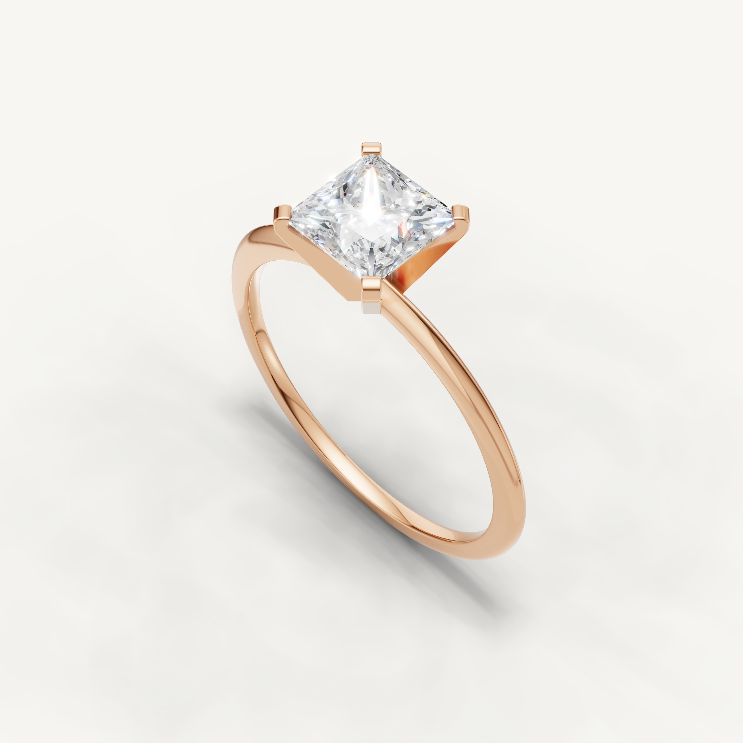 Thin band princess cut solitaire ring in rose gold by Raul Diamonds