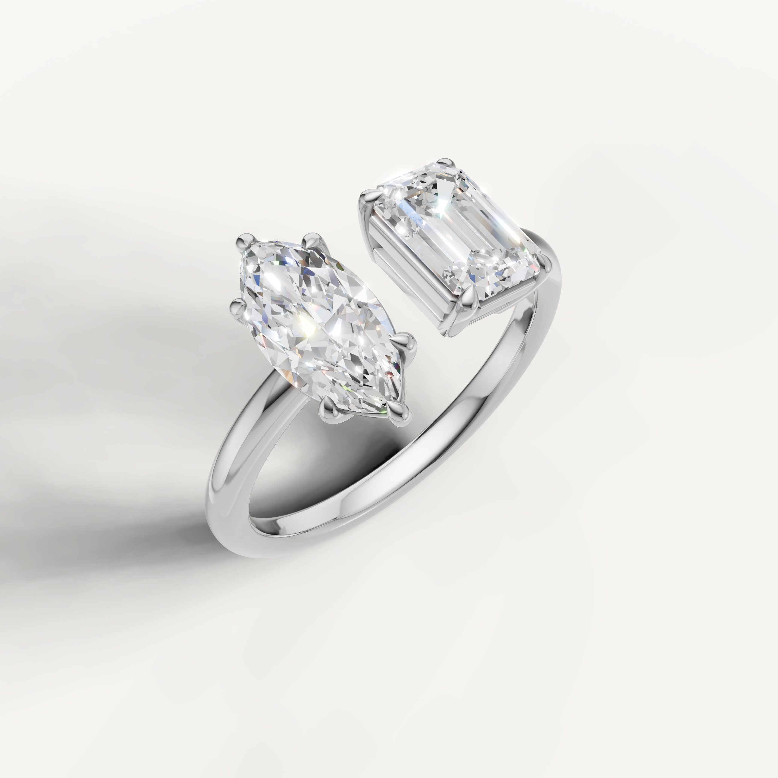 White gold dual stone diamond ring with marquise and emerald cut solitaires by Raul Diamonds