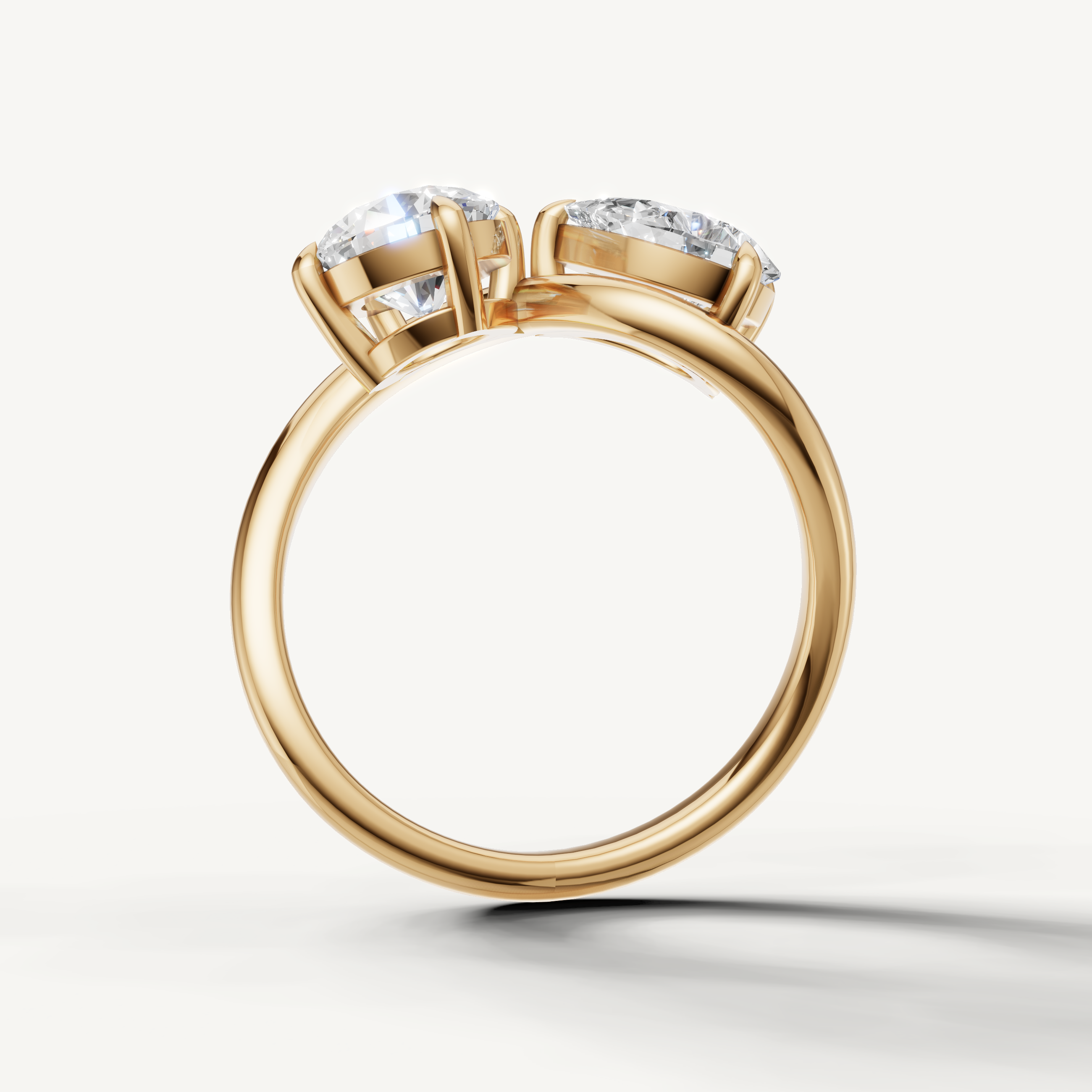 Handmade yellow gold pear and round cut diamond ring crafted by Raul Diamonds