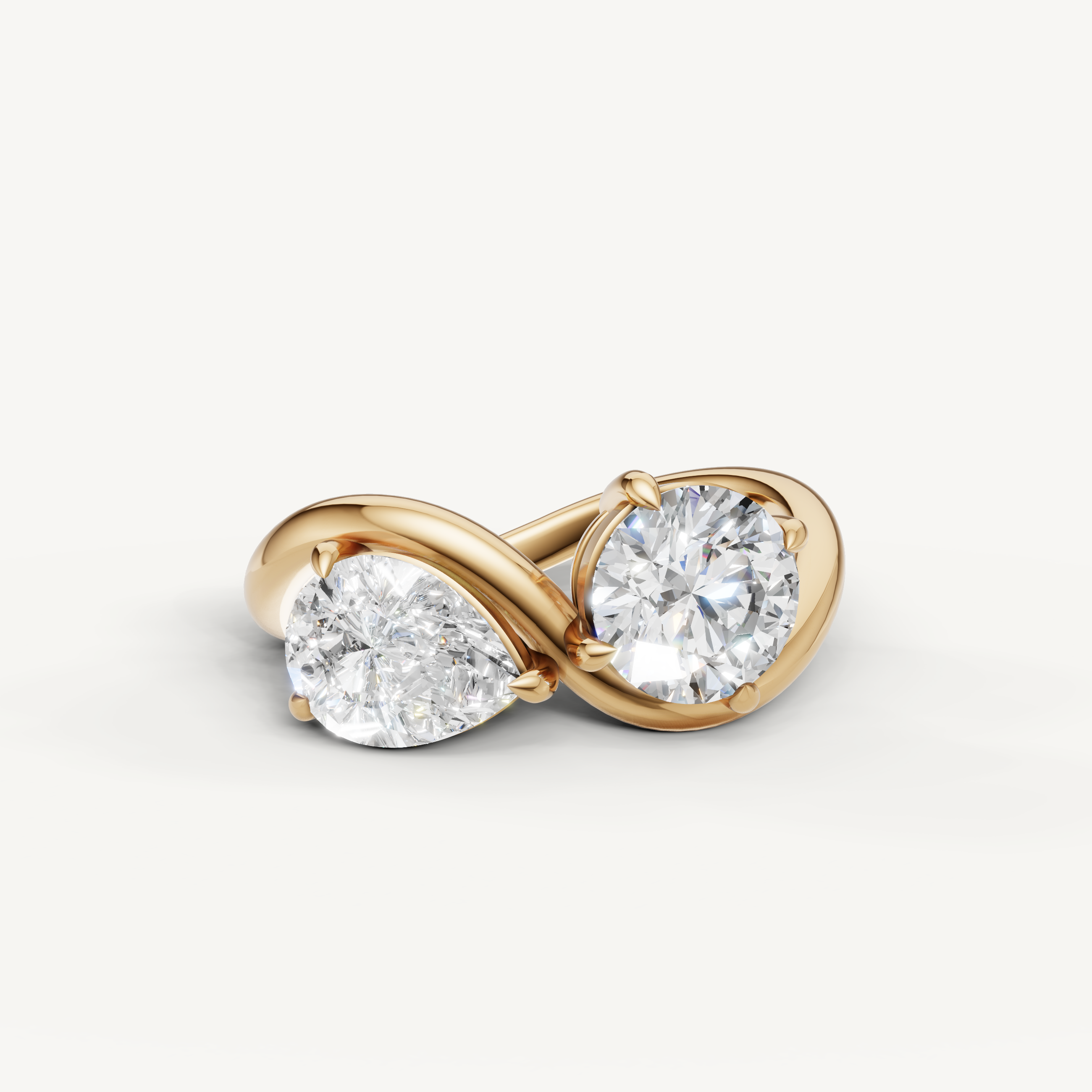 Raul Diamonds toi et moi engagement ring in yellow gold with pear and round cut diamonds