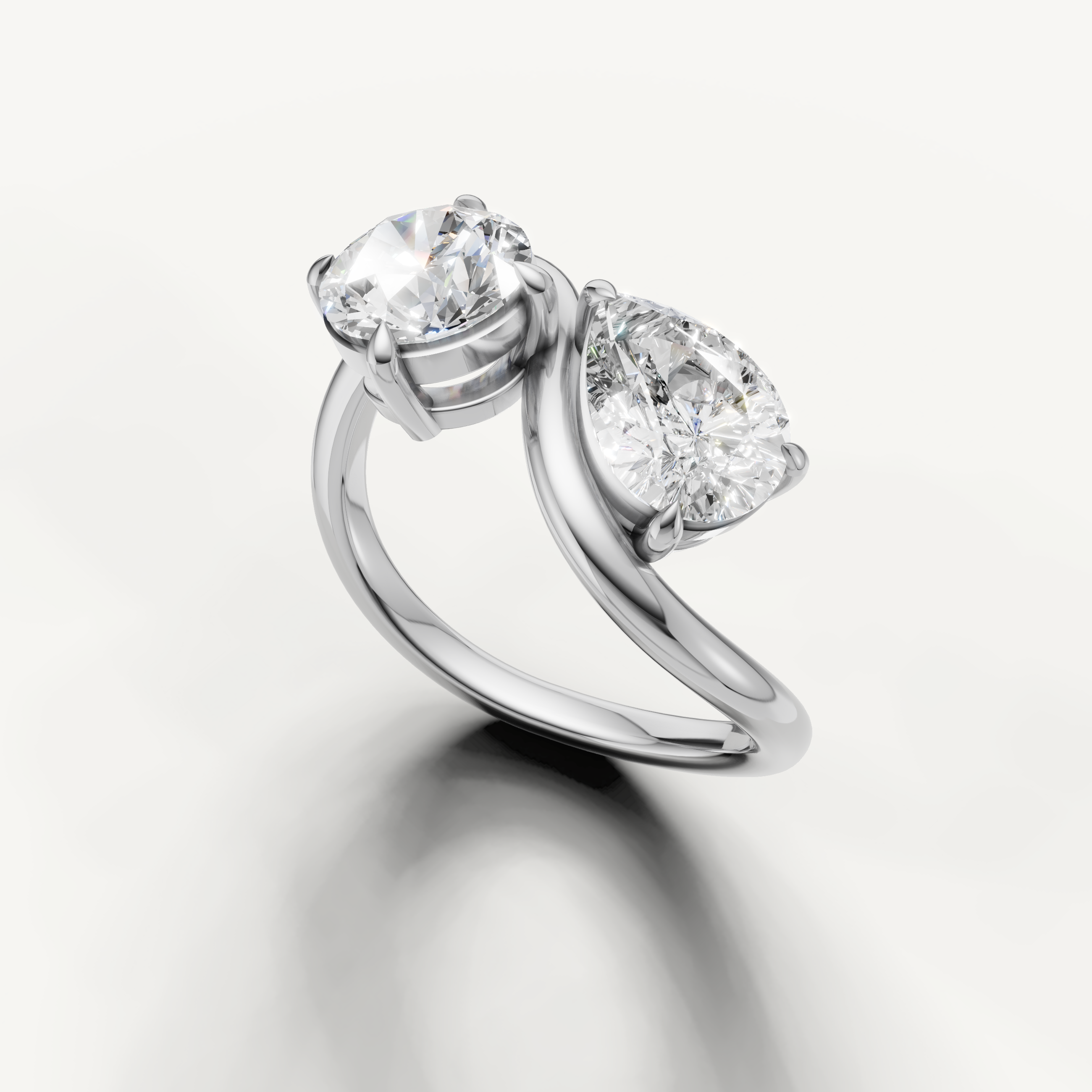 Elegant white gold toi et moi diamond ring with modern bypass setting by Raul Diamonds
