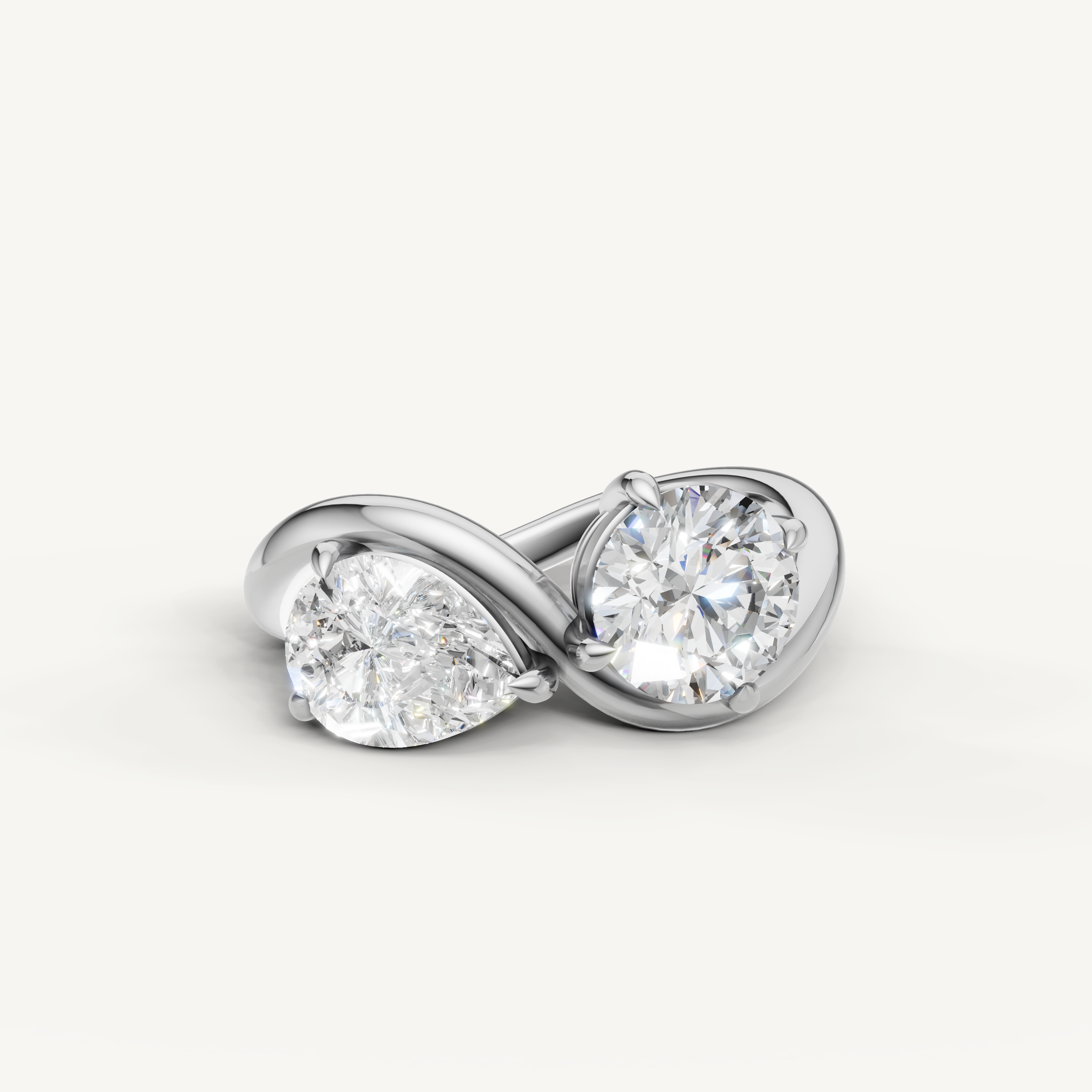 Raul Diamonds toi et moi engagement ring in white gold with pear and round cut diamonds